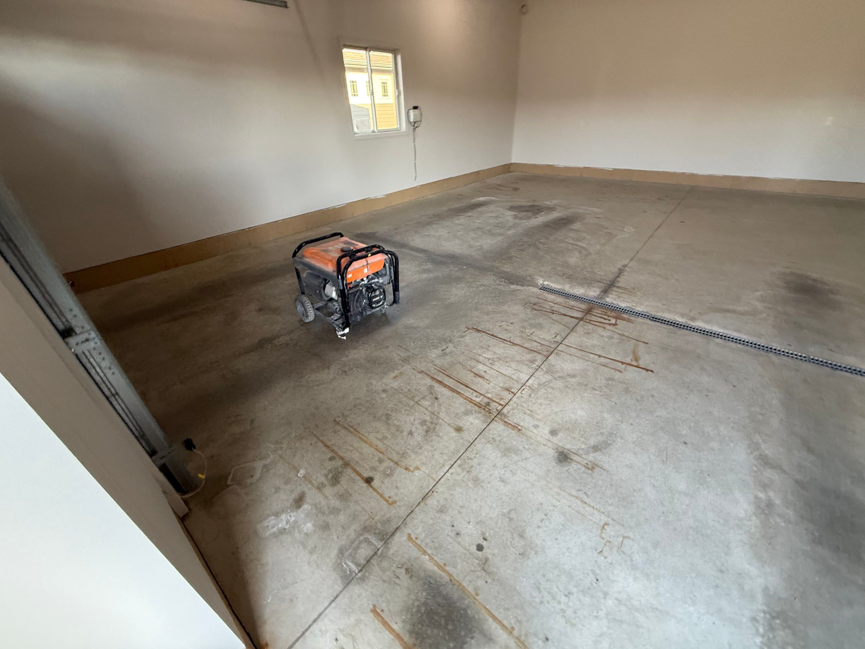 Multi-Car Garage Epoxy Floor Coating in Beresford by Select Painting, Coatings & Garage Cabinets