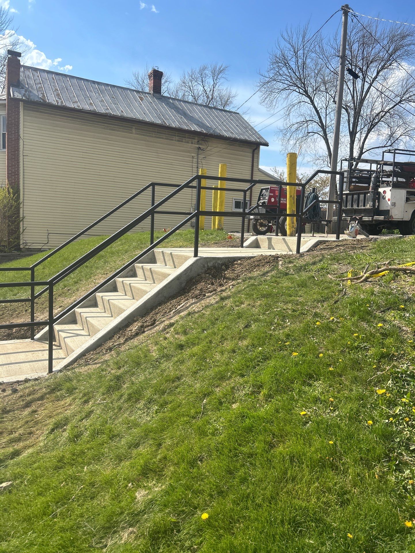 Concrete Staircase and Metal Handrail Installation in Sunbury by Concrete One Construction