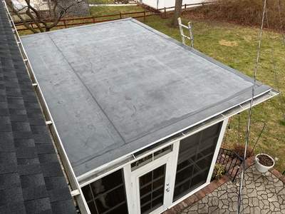 Residential Roofing Installation using 60 mil rubber roof 