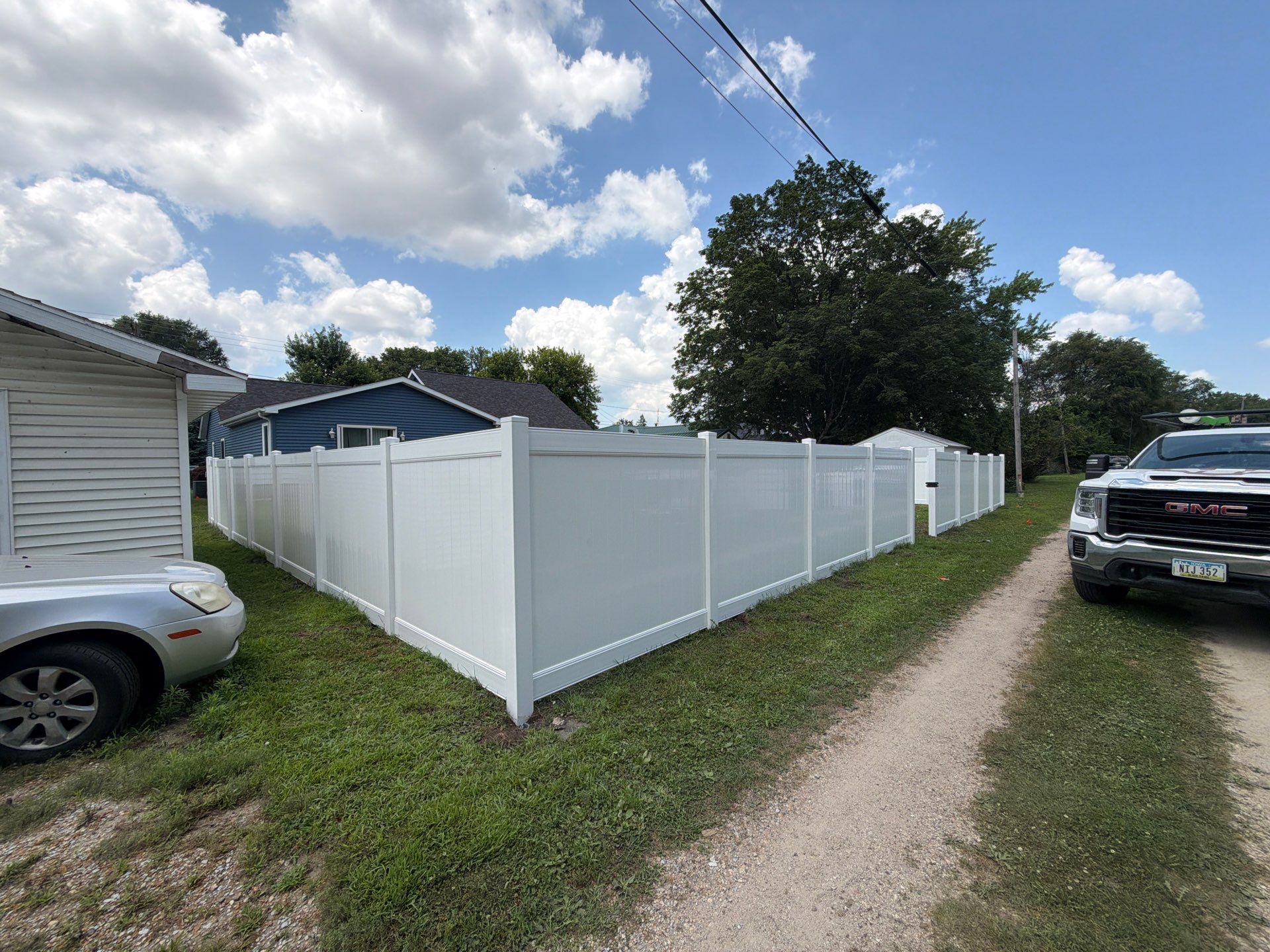 White Vinyl Privacy Fence Installation in Waterloo, Iowa by Perfect Picket Fence and Stain