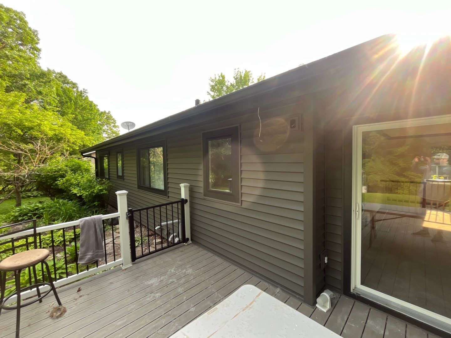 Premium Exterior Remodel – Alside Charter Oak Siding, Hayfield Black Frame Windows, Edco Soffit & Fascia by First Impressions Exteriors