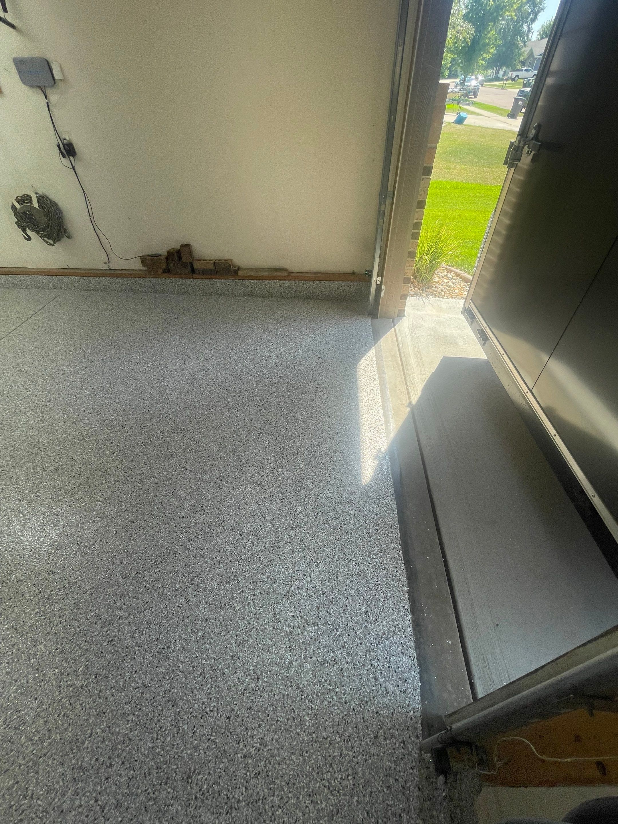 Multi-Stall Garage Floor Coating Installation in Sioux Falls by Select Painting, Coatings & Garage Cabinets