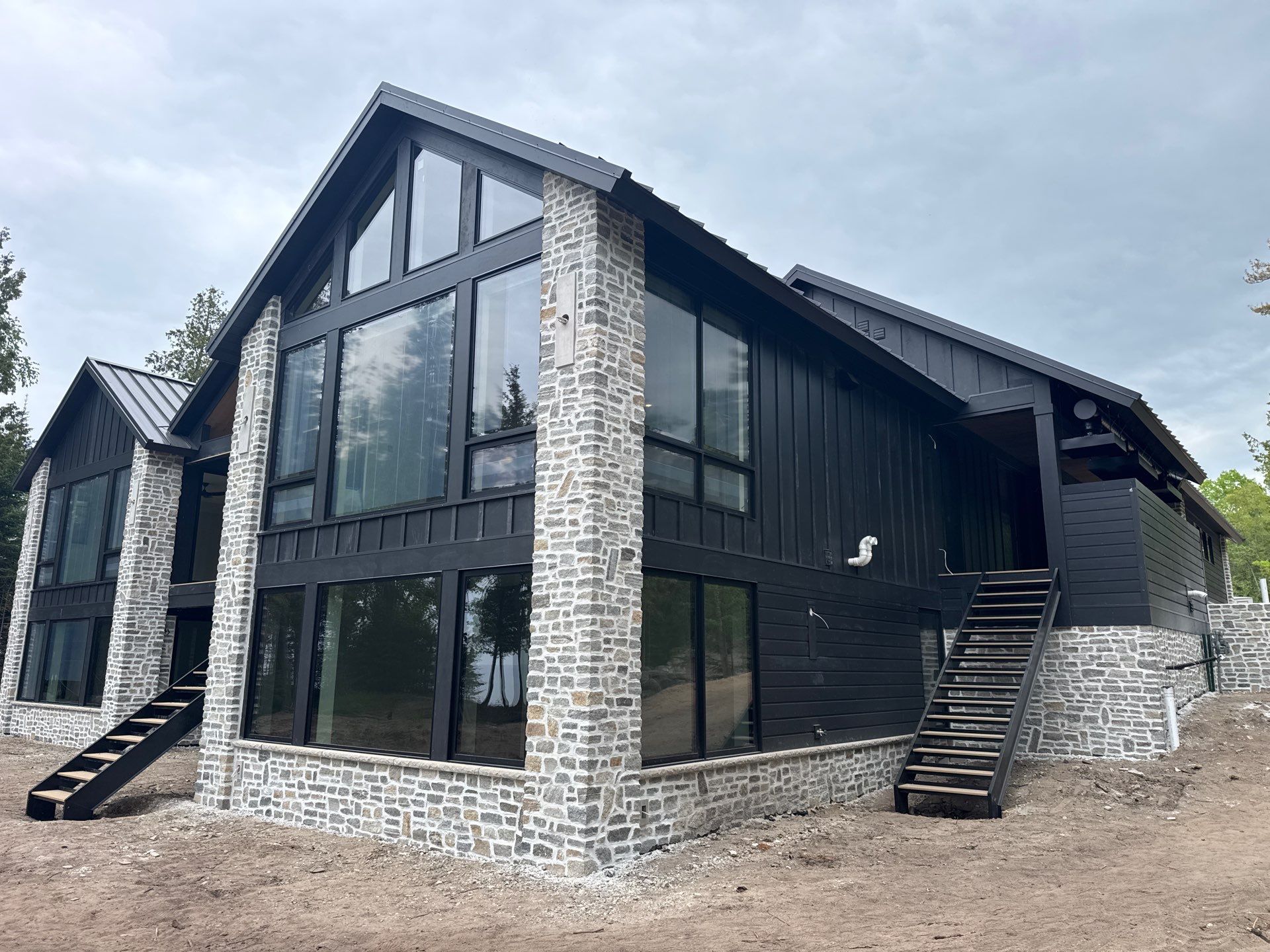 Gutter and Drainage System Installation for Modern Residential Build by Rainbow Seamless Systems
