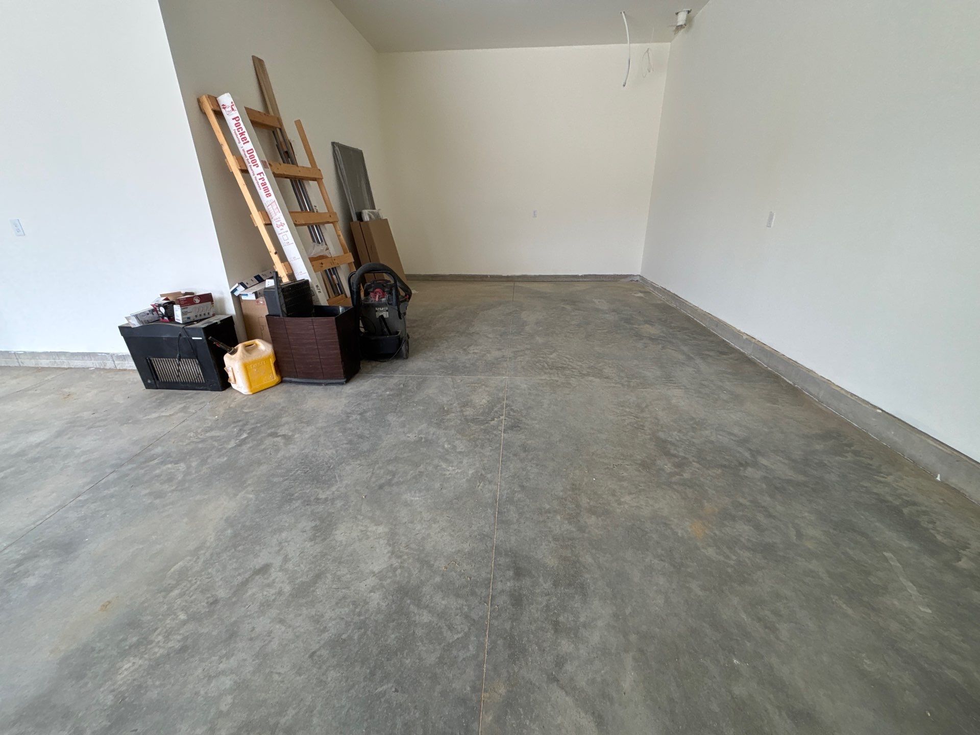 Sioux Falls Garage Floor Transformation with Gray Decorative Flake Coating by Select Painting, Coatings & Garage Cabinets