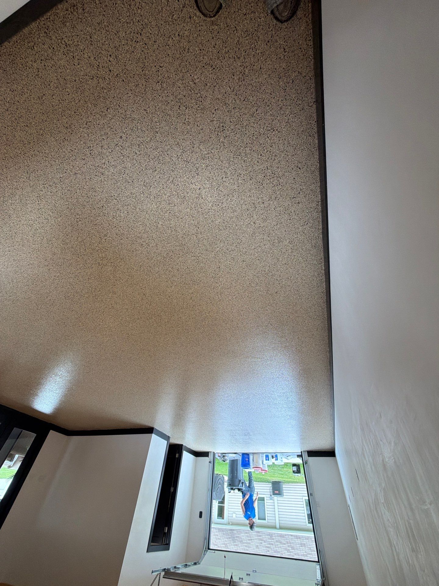 Multi-Room Epoxy Flake Floor Installation Throughout Pentwater Residence by Gordon Painting