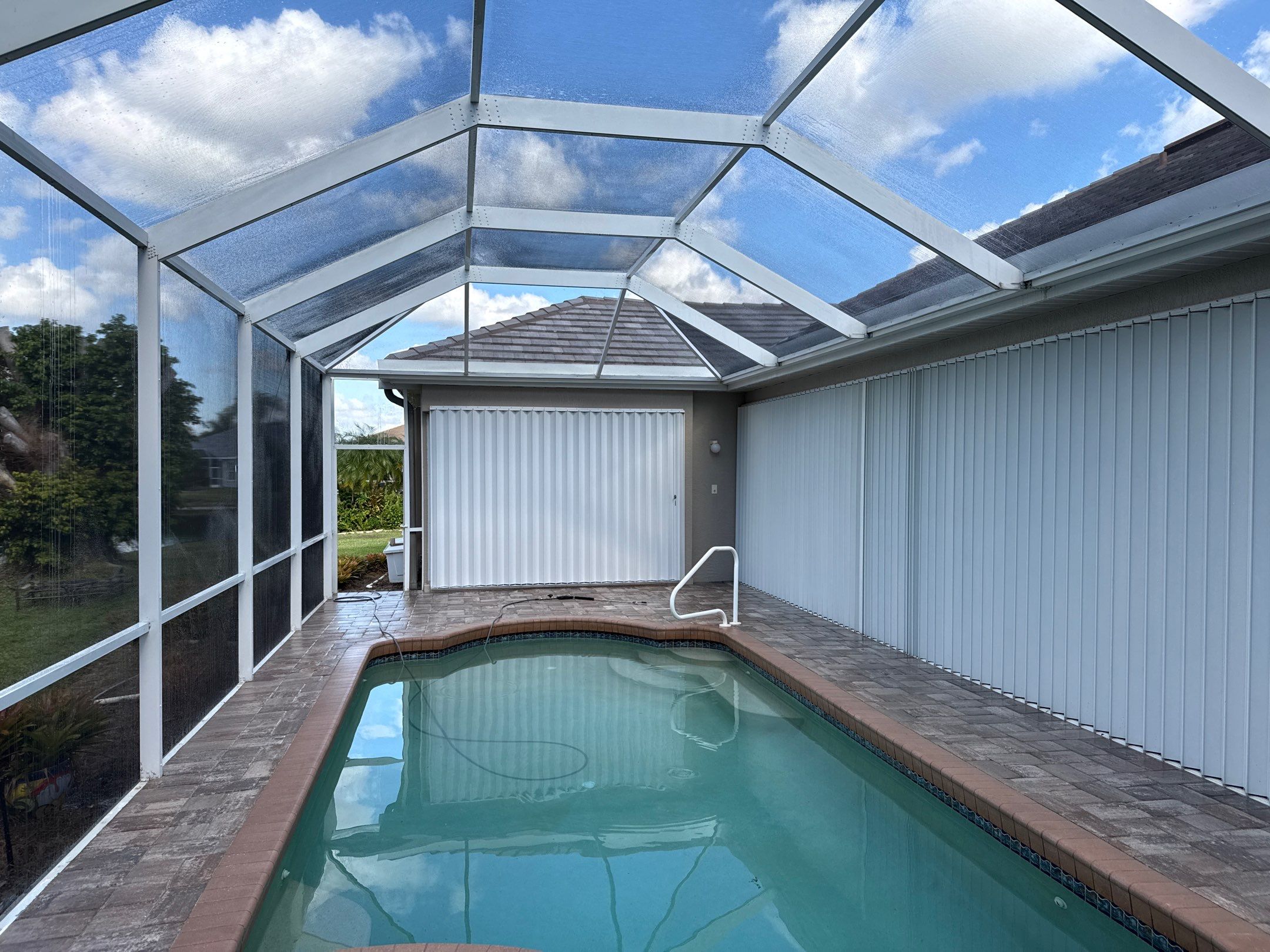 Paver Pool Deck & Screen Enclosure Transformation | University Park, Sarasota FL by Sunshine AquaWash