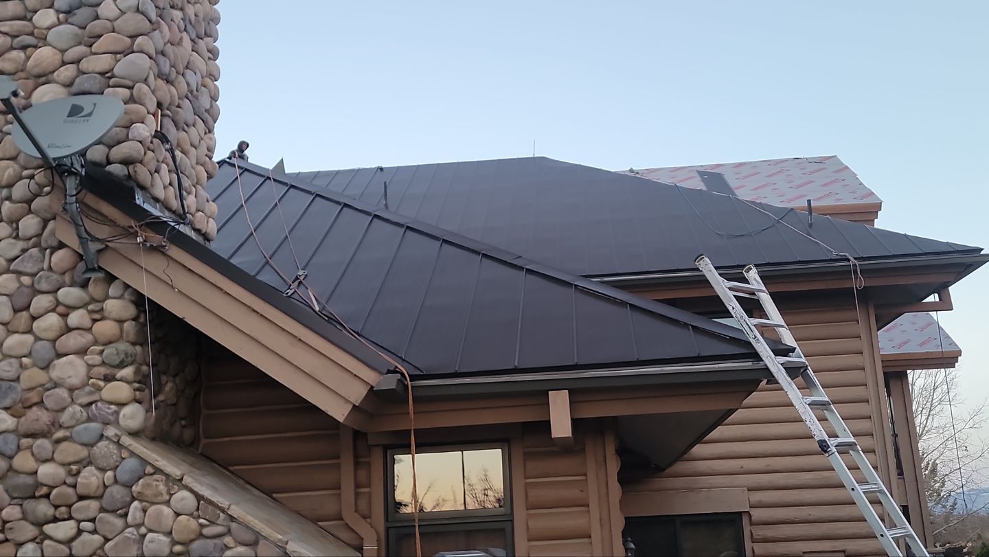Standing Seam Metal Roof Replacement After Snow Damage by ASAP Roofing & Restoration
