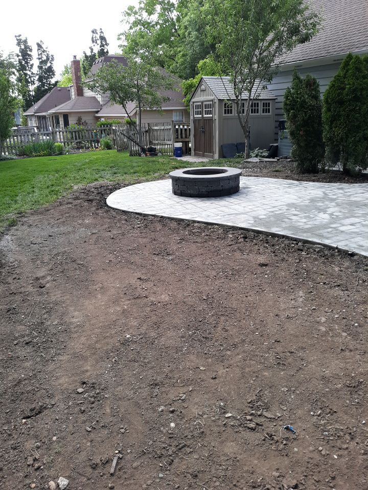 Back Yard Stamped Patio by LAND ESCAPES LLC