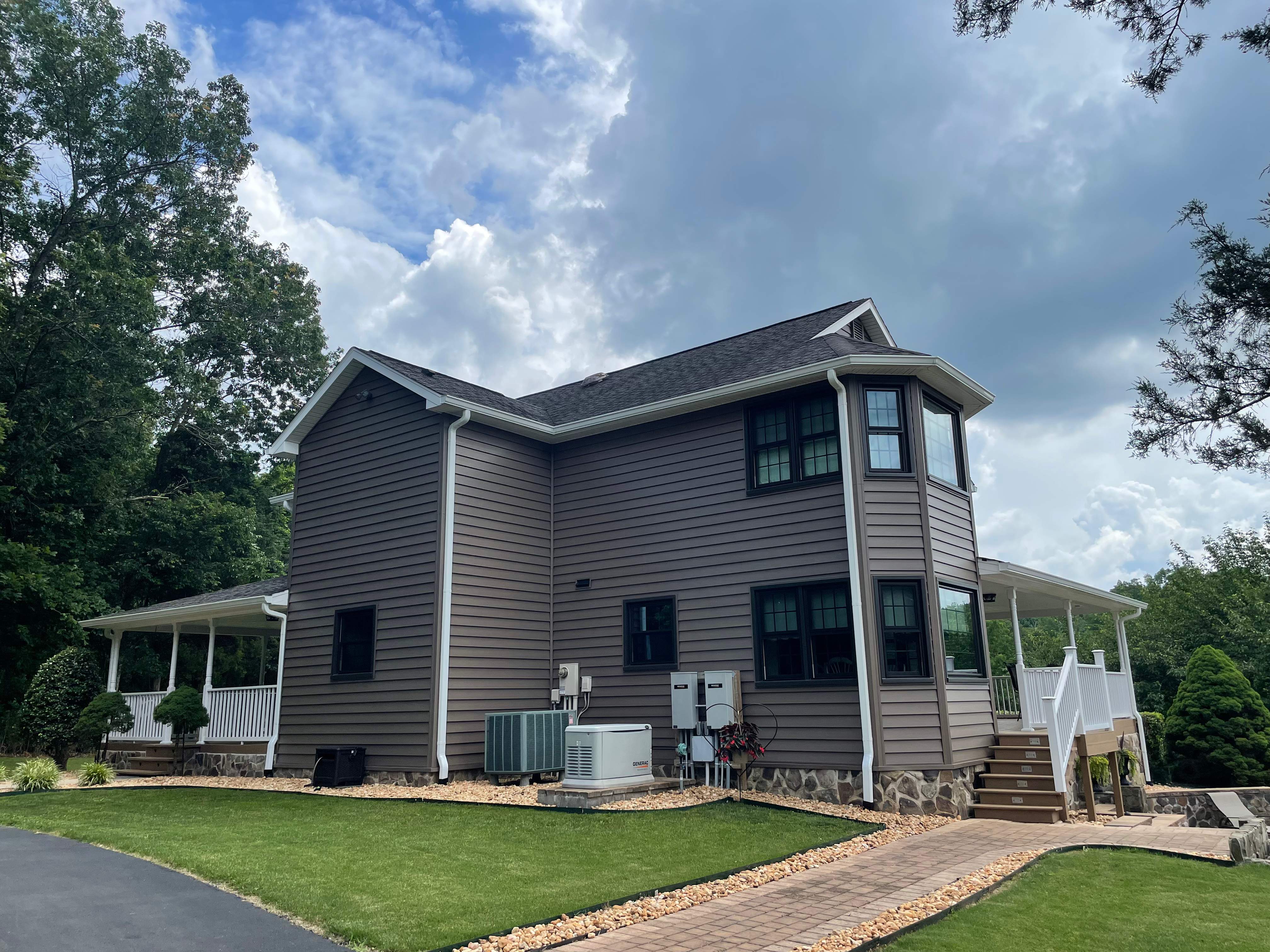 Exterior remodel including window replacement by American Home Contractors