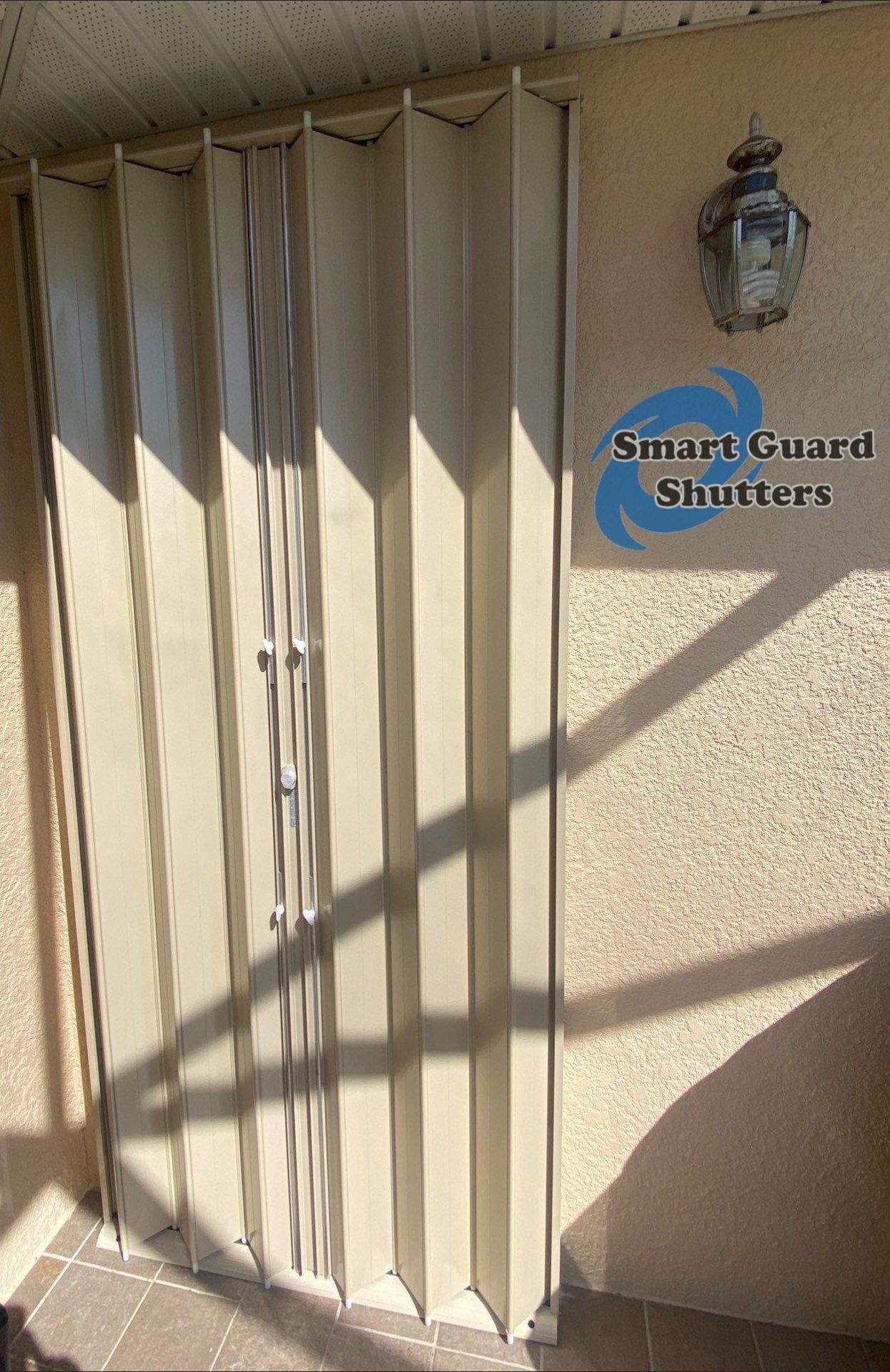 Accordions in Beige by Smart Guard Shutters