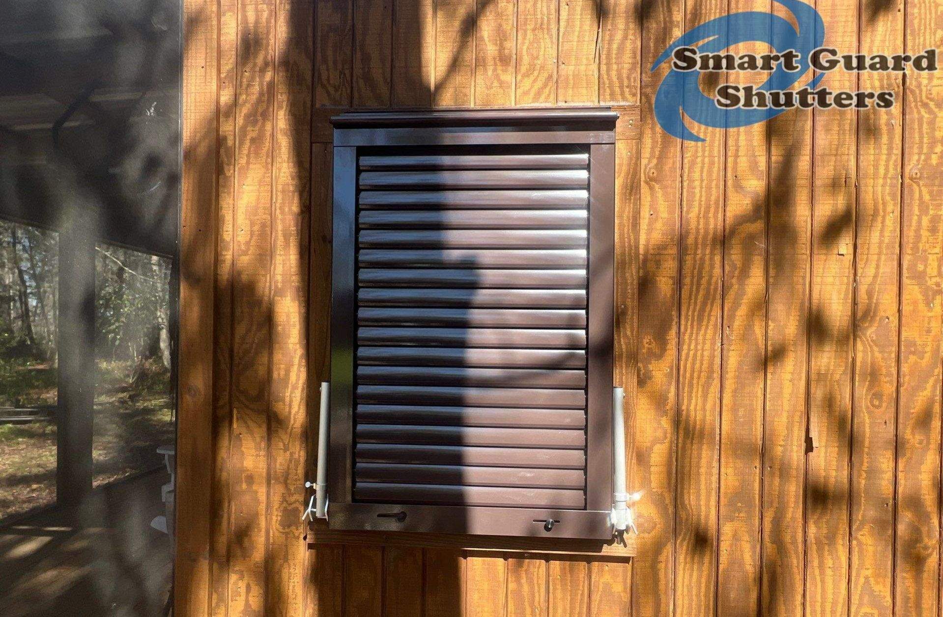 Hurricane Protection in Bronze/Grey Brown by Smart Guard Shutters