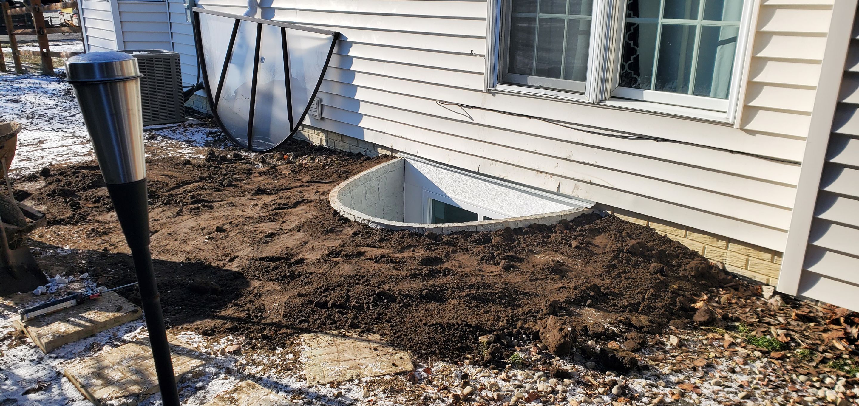 Egress Window Installation using Rockwell Egress Fiberglass Egress Window Well by Toledo Basement Repair 
