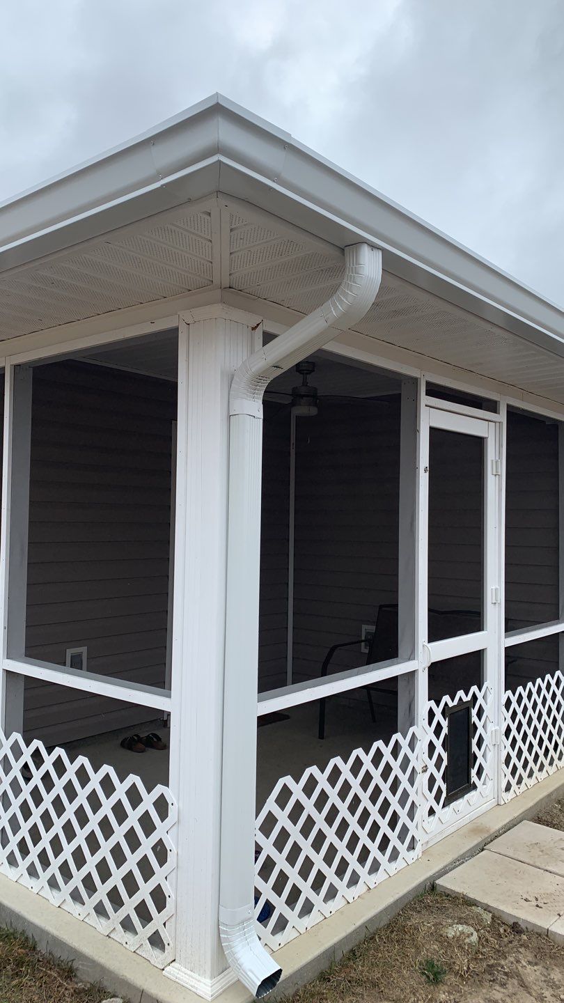 Seamless Gutter Installation Using White 6 Inch Gutters by Gutter Professors