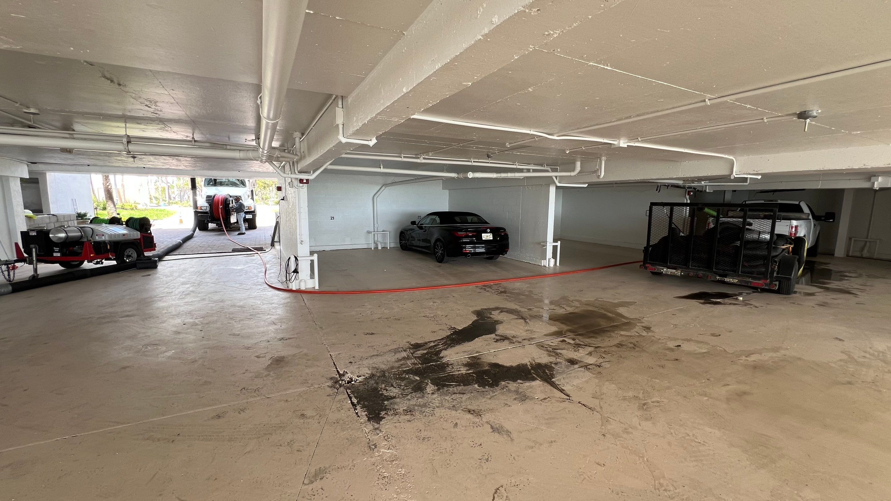 Isles of Capri Condo Parking Garage Drainage System Cleaning by APS Power & Water