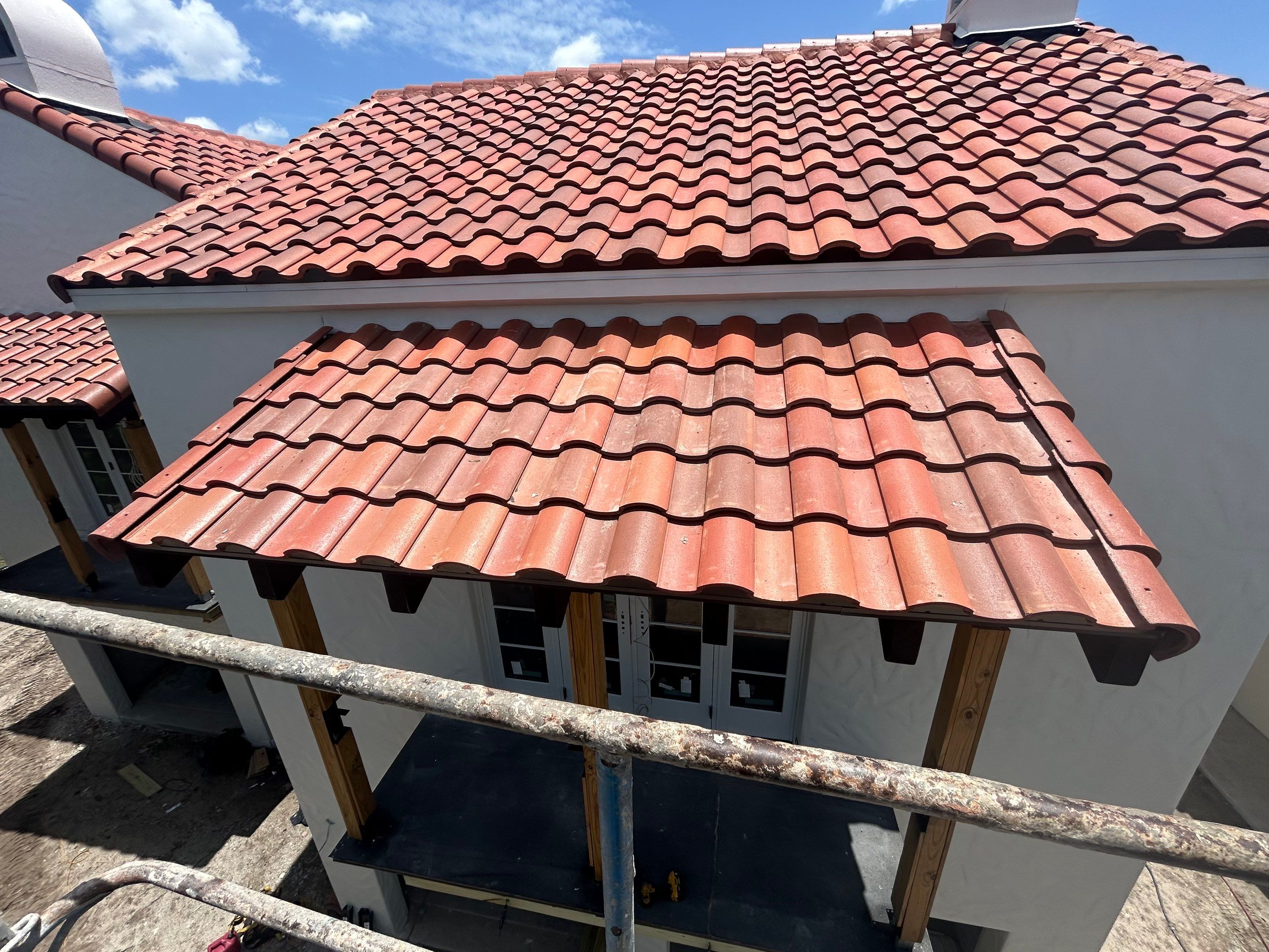 Multi-Story Clay Tile Roof Installation in Winter Park by Tip Top Roofing Co., Inc.