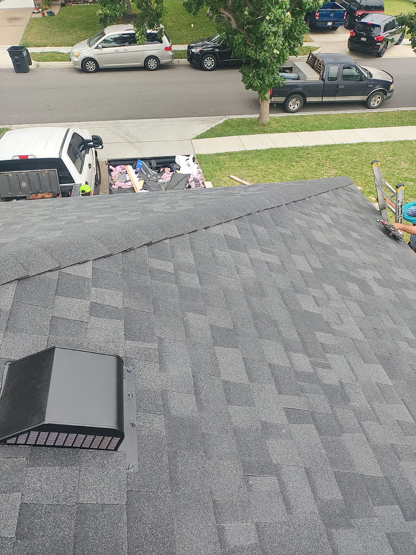 Nothing looks nicer than a little black roof by Bayfront Roofing and Construction