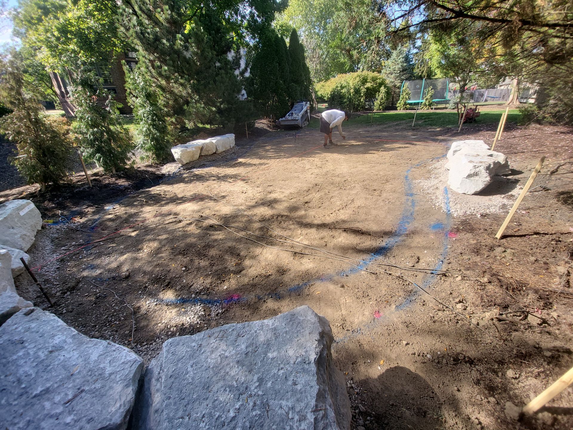 Custom Backyard Putting Green around Landscape Boulders in Hilliard by Southwest Greens Midwest