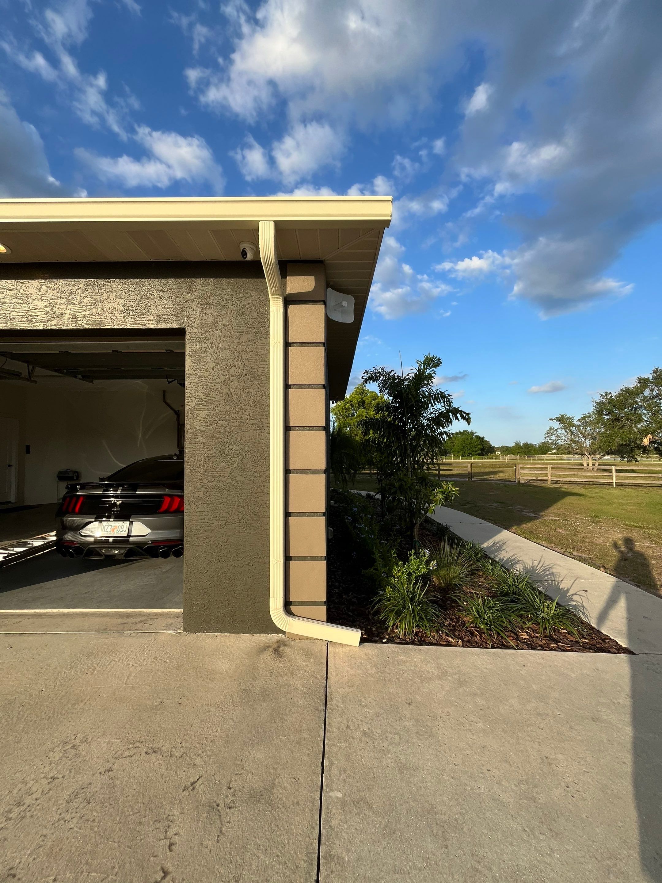  7-inch White seamless gutters and downspouts in Myakka City FL by Gutter Professors