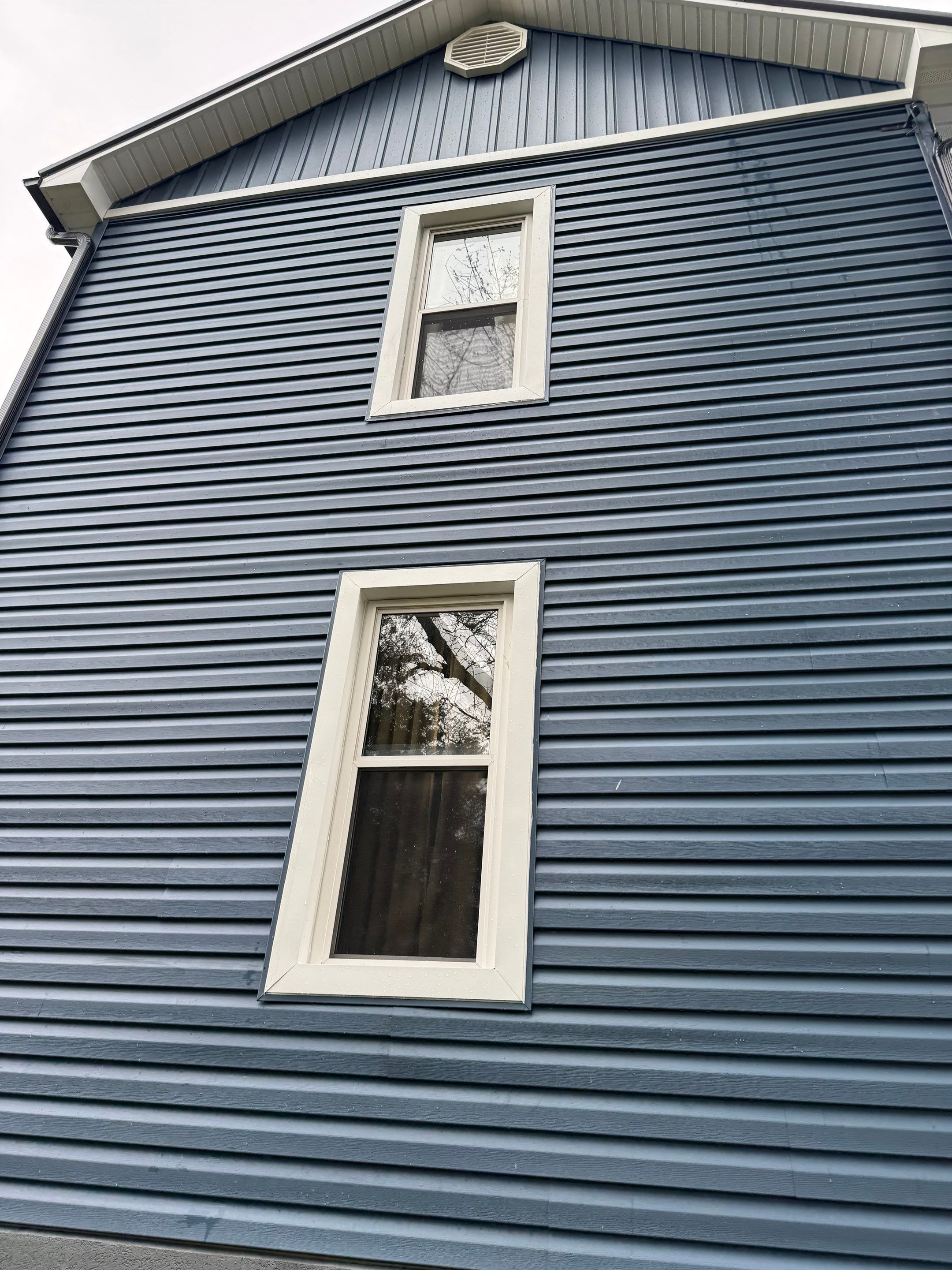 White Frame Window Replacement for St Clairsville Board-and-Batten Exterior by Ohio State Windows