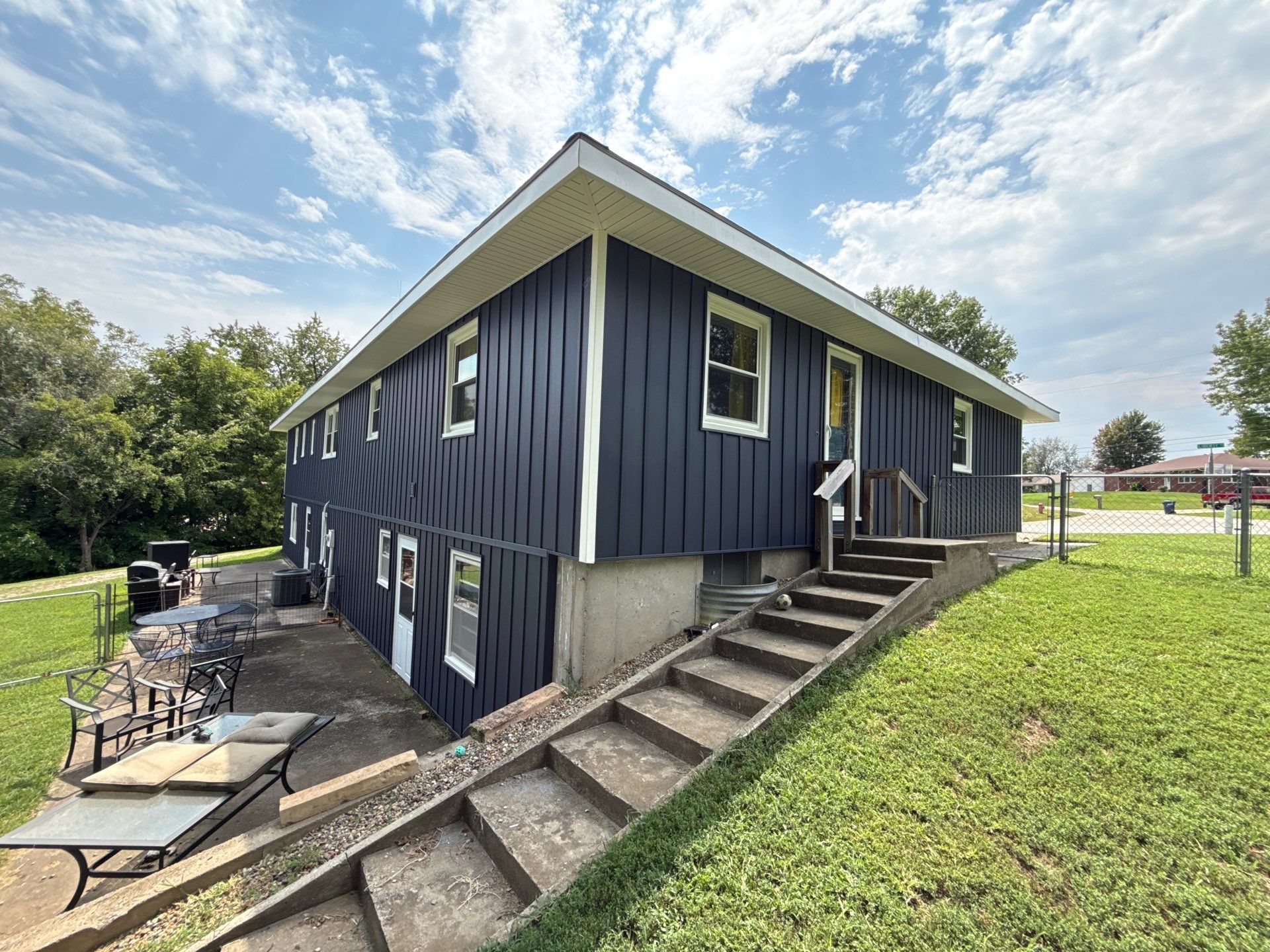 Indigo Board and Batten Siding and Window Replacement in Smithville by EEC Windows, Siding & Roofing
