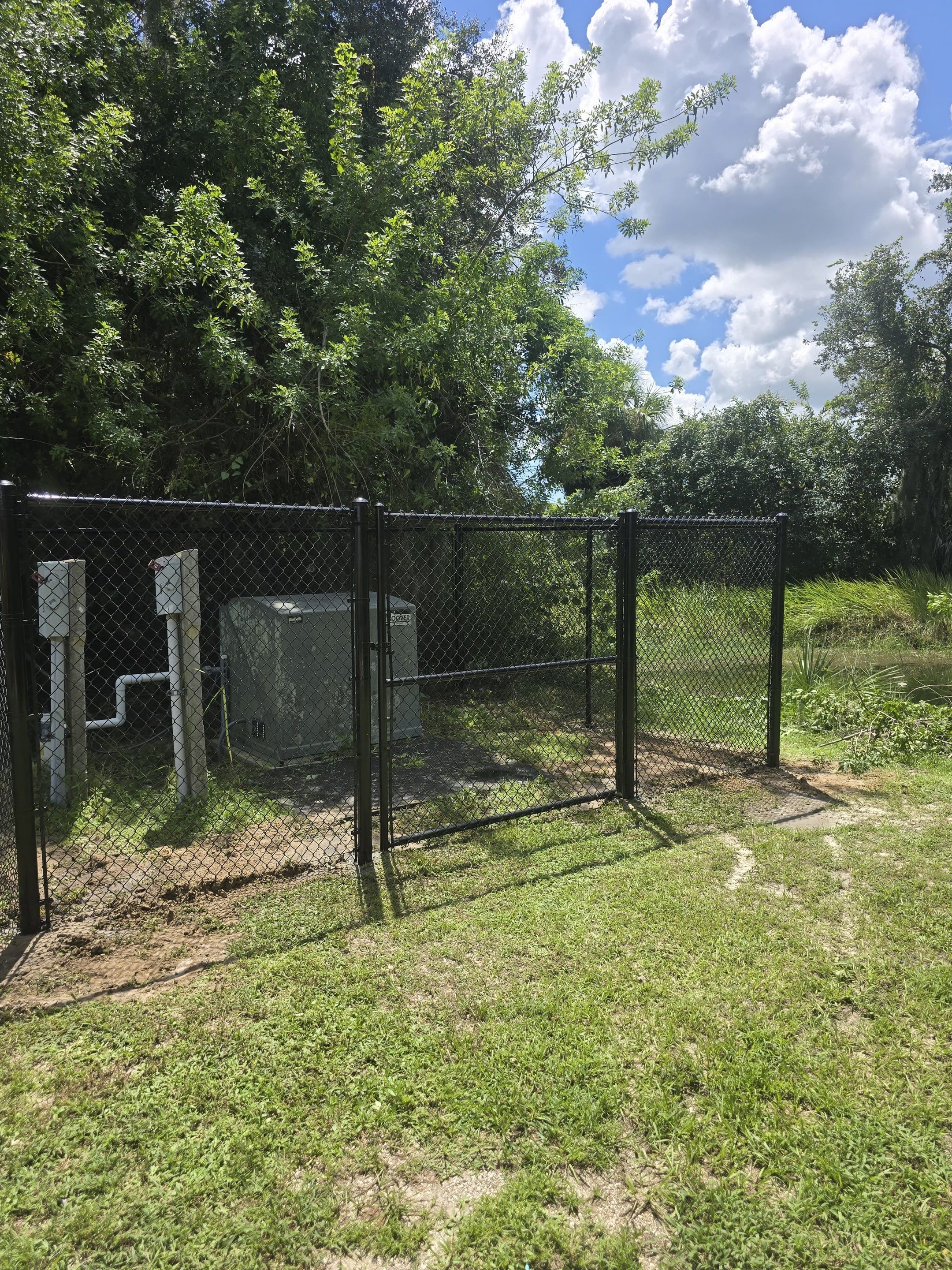 Commercial Black Chain Link Fence Installation in North Port by True Fence LLC