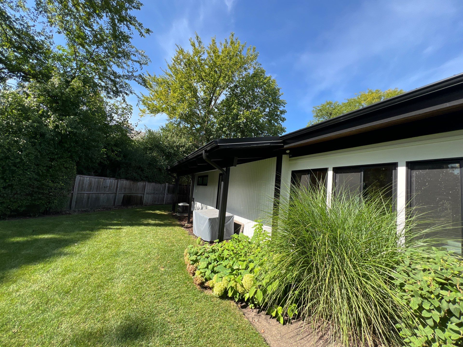 Complete Exterior House, Bluestone & Garage Floor Cleaning by Northern Power Washing LLC.