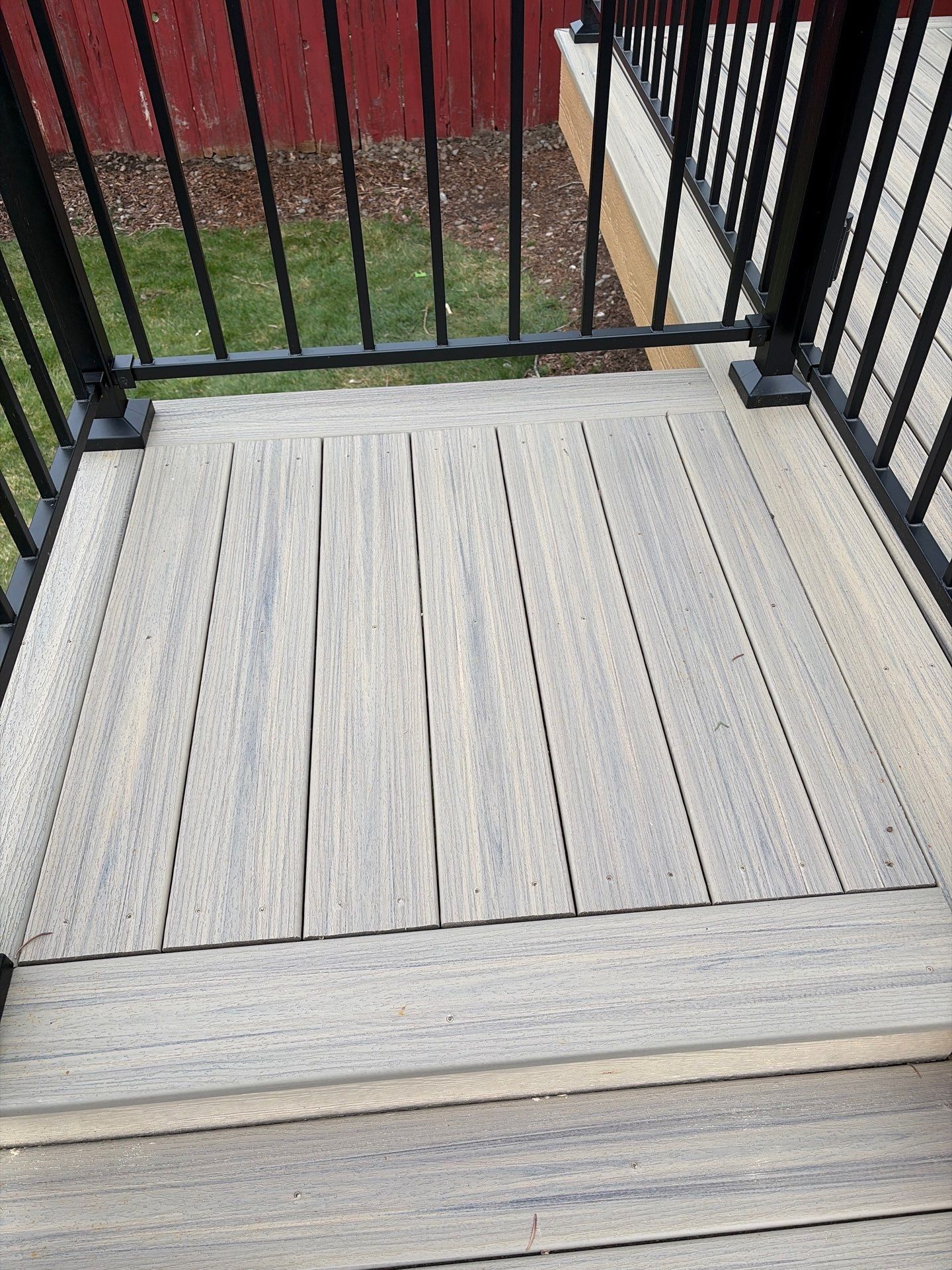 Add a platform deck below an existing elevated deck that was there prior by Home Helpers General Contracting