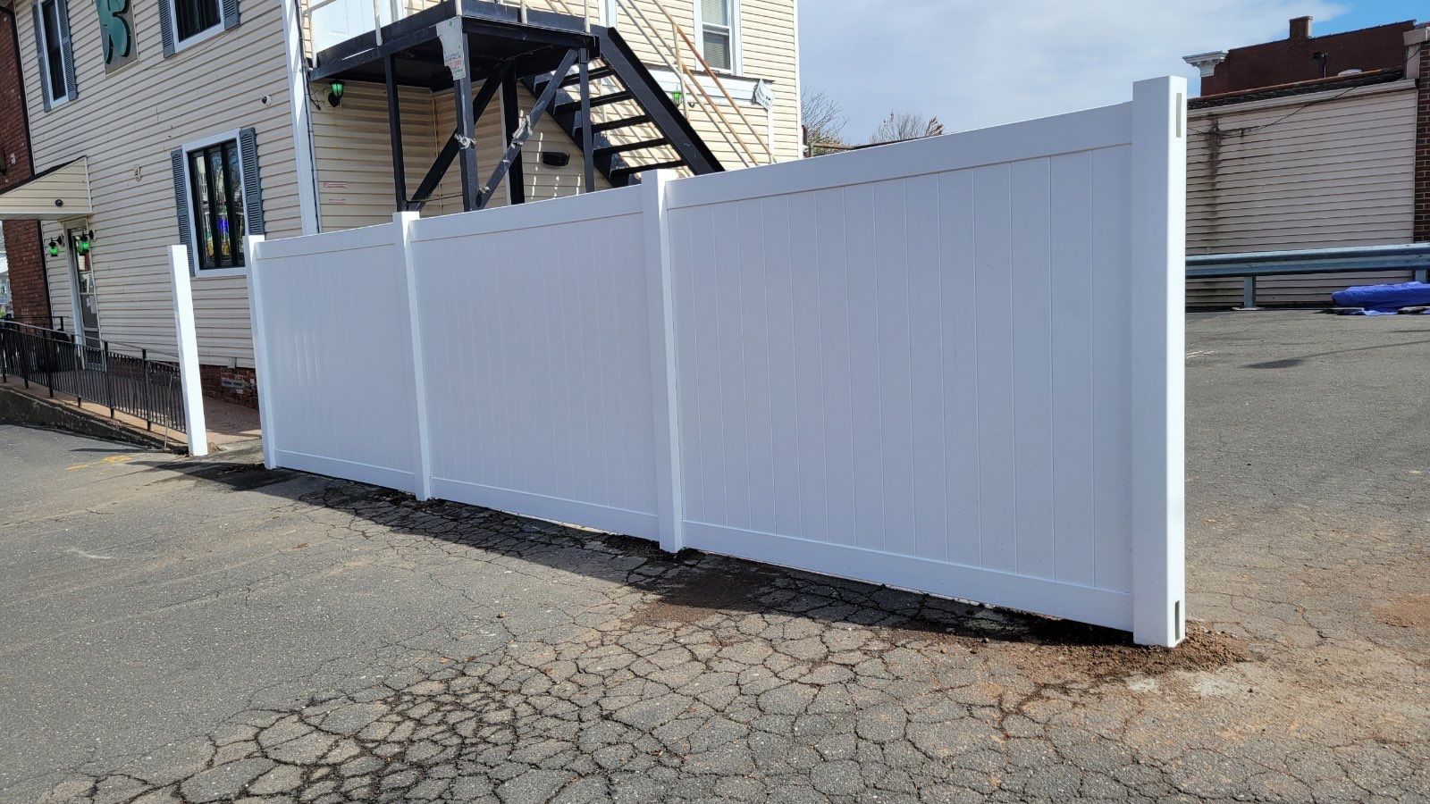 Vinyl Privacy Fence, With matching gate in White  by DiGiorgi Roofing and Siding Inc