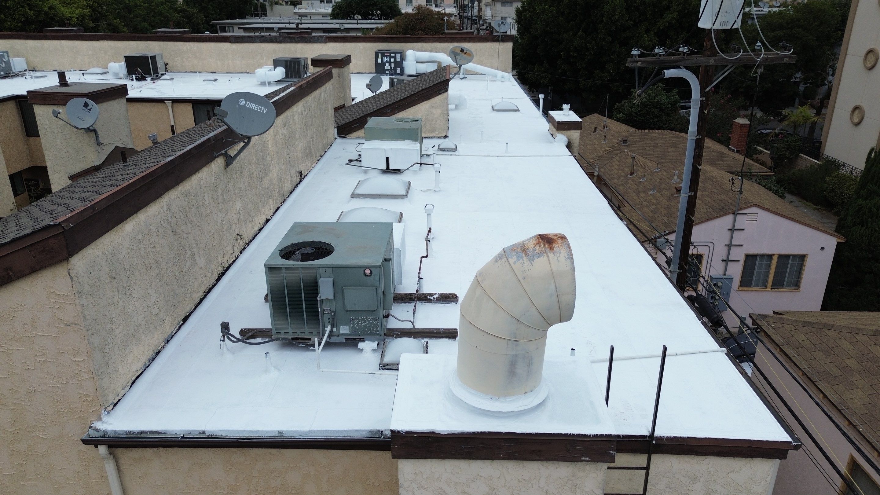 Apartment Building Silicone Coating by Hull Brothers Roofing