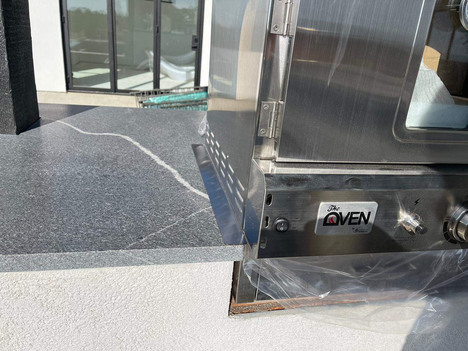 Outdoor kitchen using Black mist honed granite by Mena stone surfaces