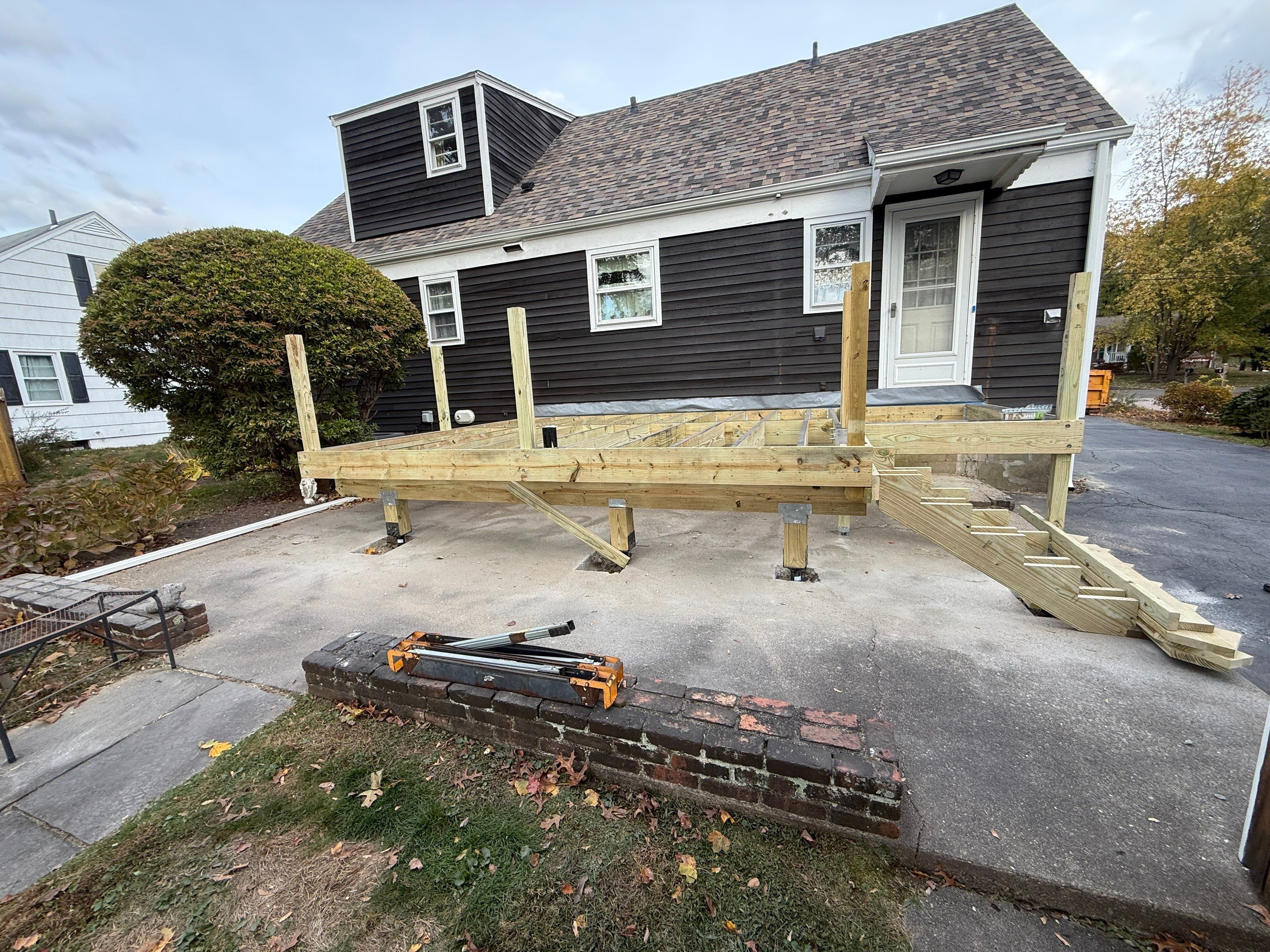 Deck replacement, using Trex Transcend Rope Swing, Transcend railings with ada graspable handrail. in white. by DiGiorgi Roofing and Siding Inc