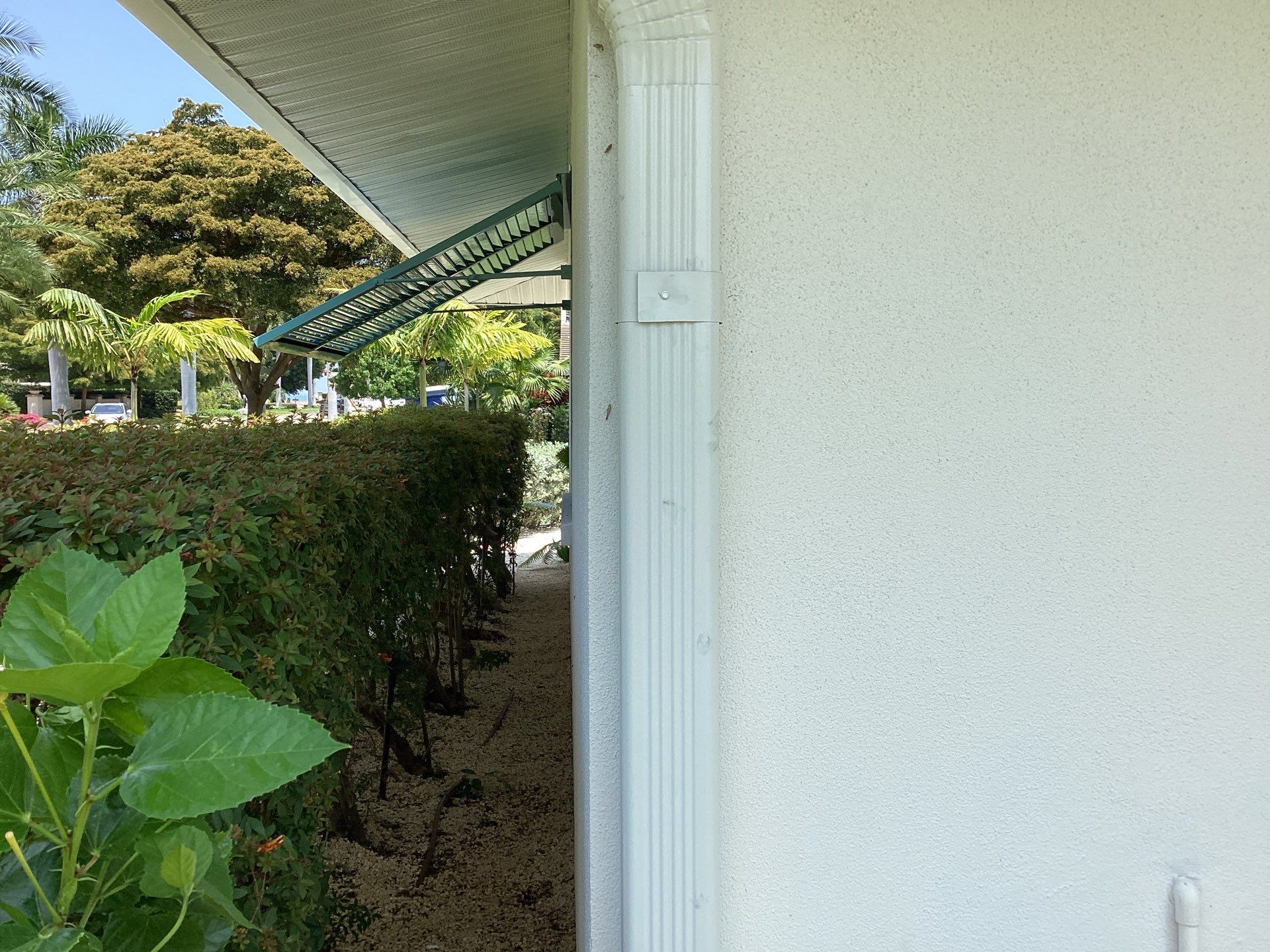 White Seamless Gutters and Downspouts in Sarasota FL by Gutter Professors