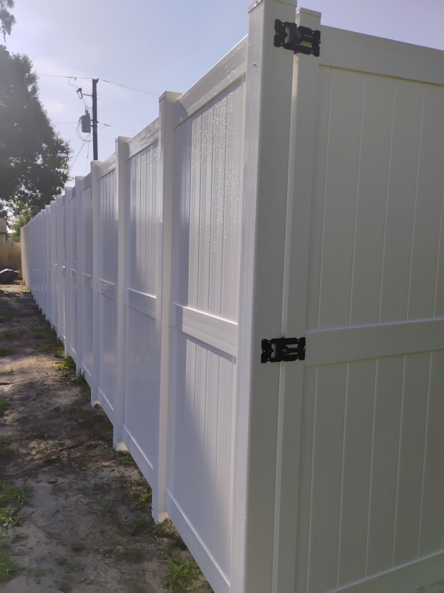 8'H White Vinyl Privacy Fence Installation in North Port by True Fence LLC