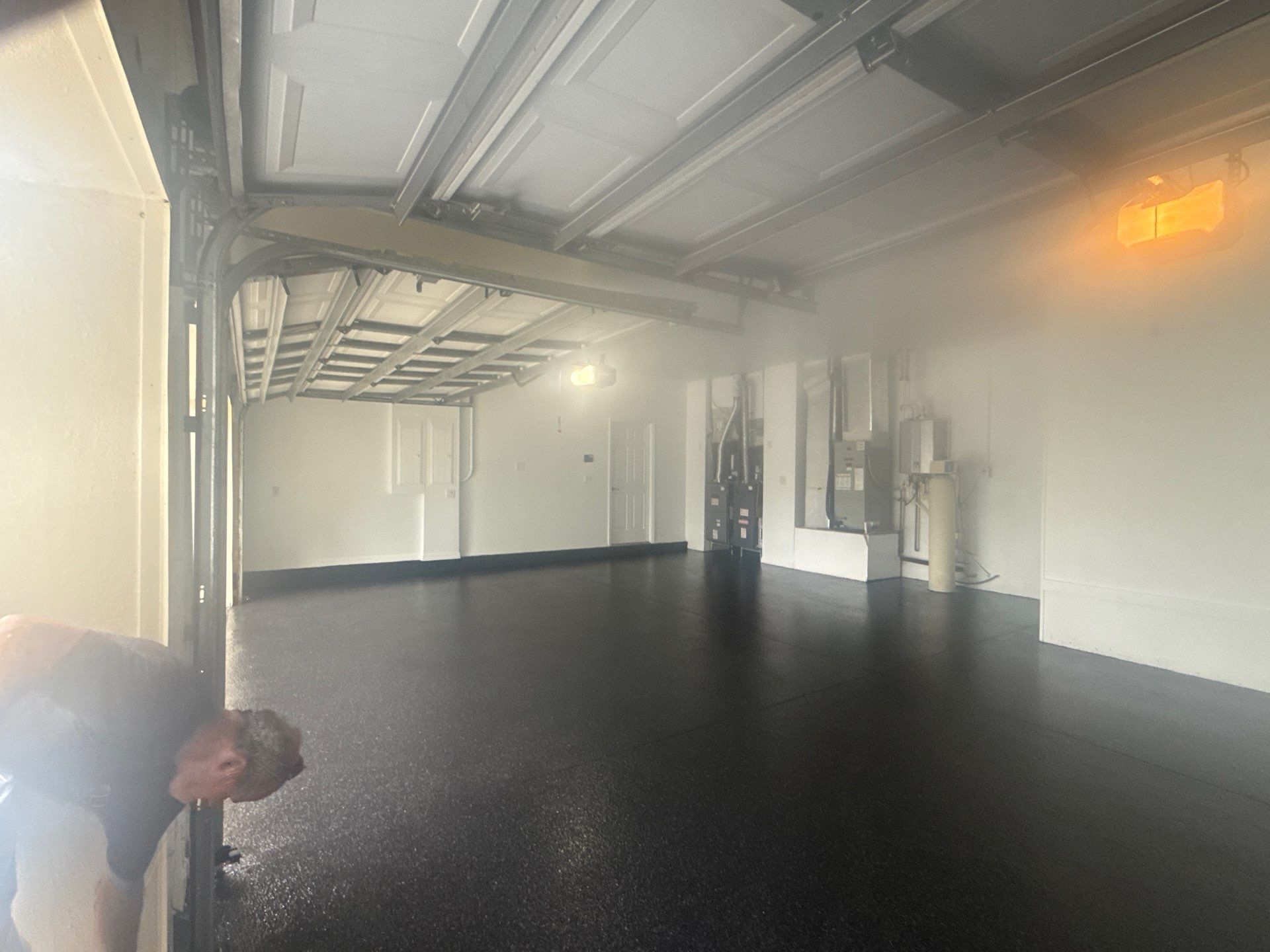 Tampa Garage Floor Coating and Overhead Storage Rack Installation by Square 1 Garage and Closet Solutions