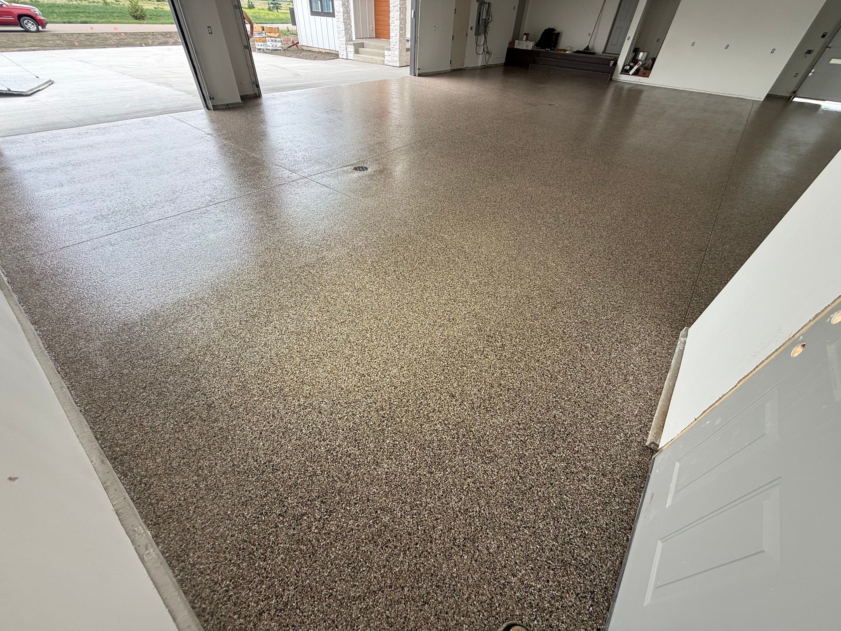 Multi-Bay Garage Concrete Coating and Floor Refinishing in South Dakota by Select Painting, Coatings & Garage Cabinets