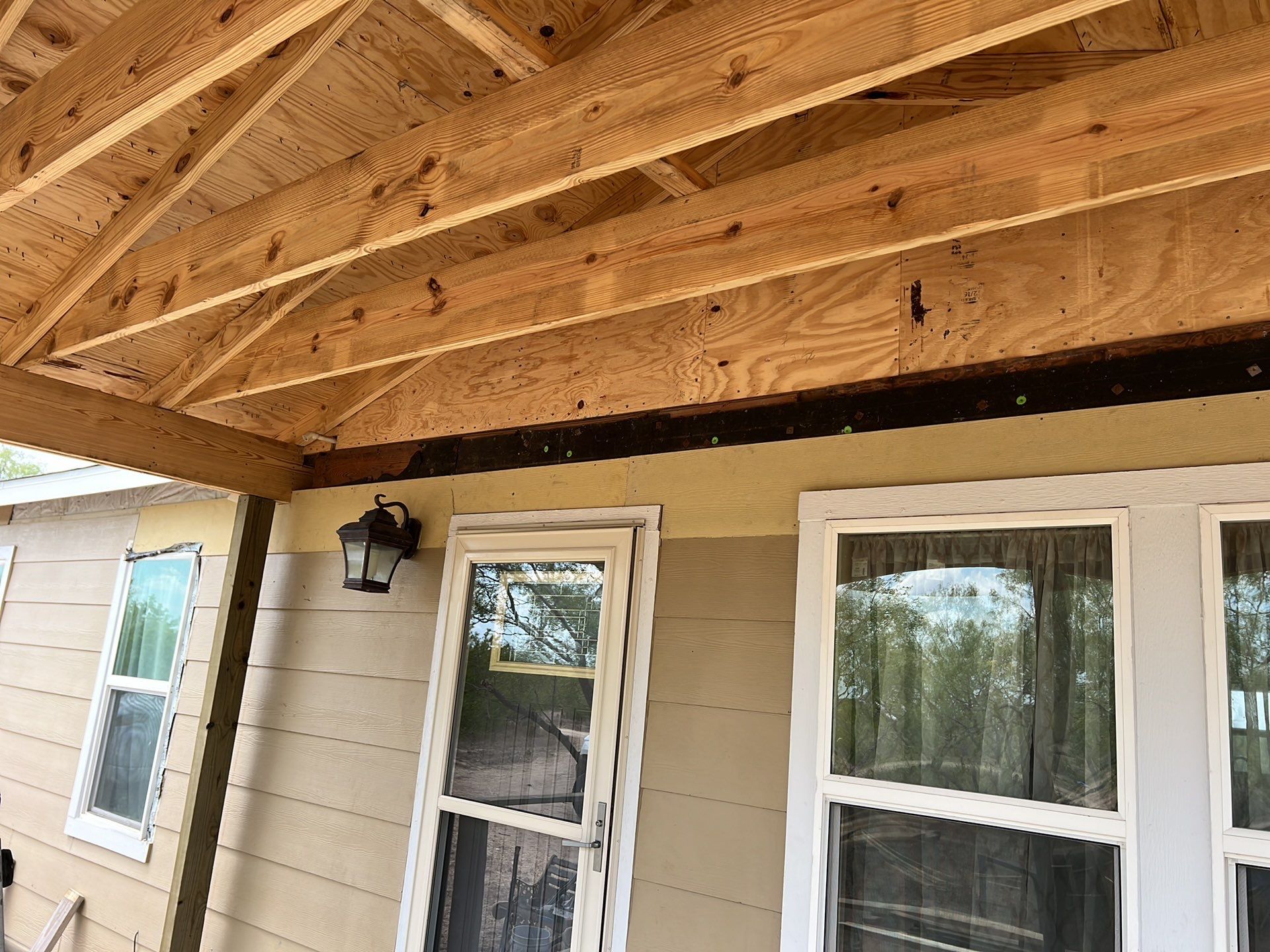 Front Porch Sitt'n by Bayfront Roofing and Construction