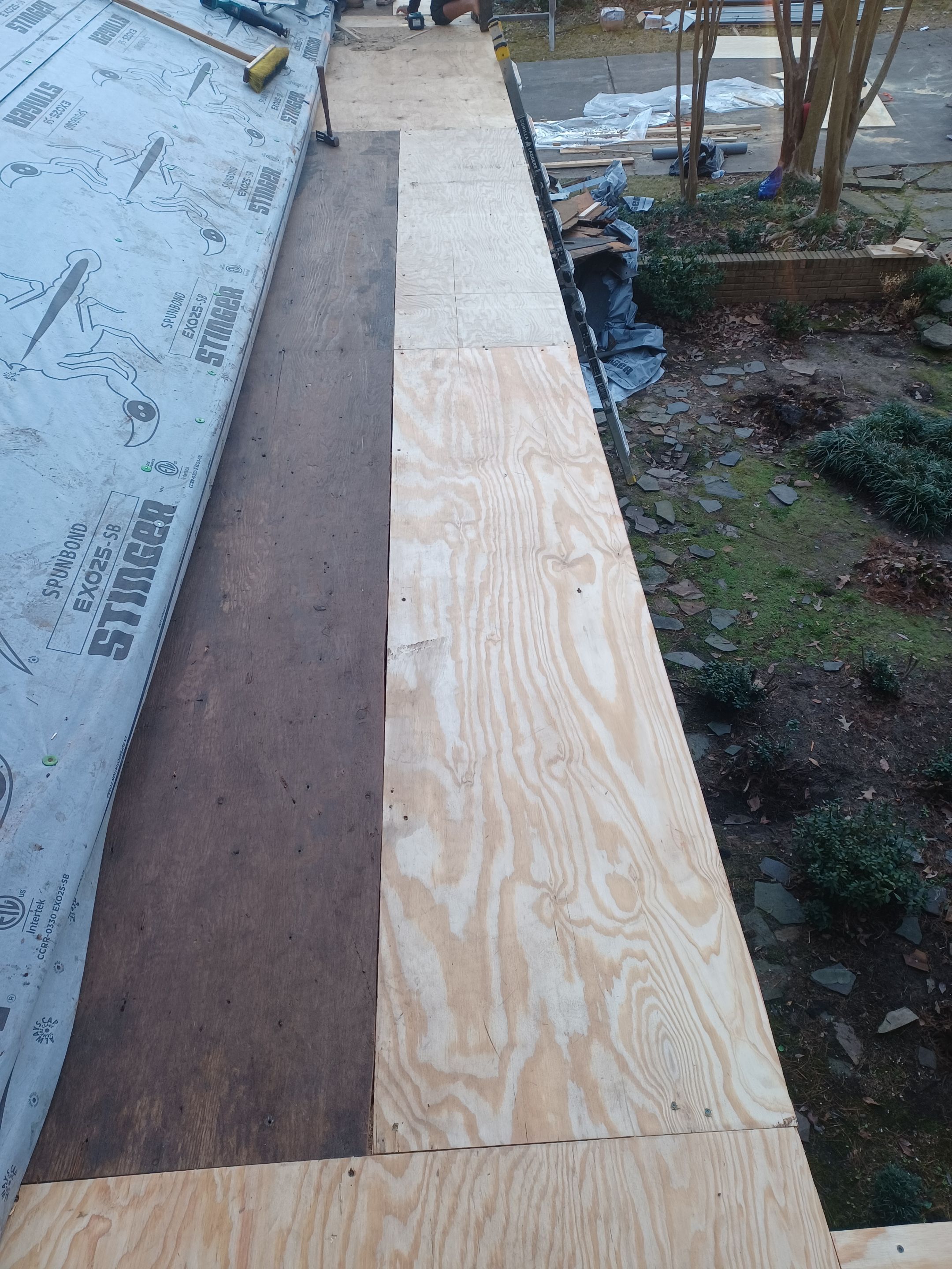 Residential Roofing Installation using PVC membrane and 24 gauge Standing Seam Metal by Hostetler Roofing