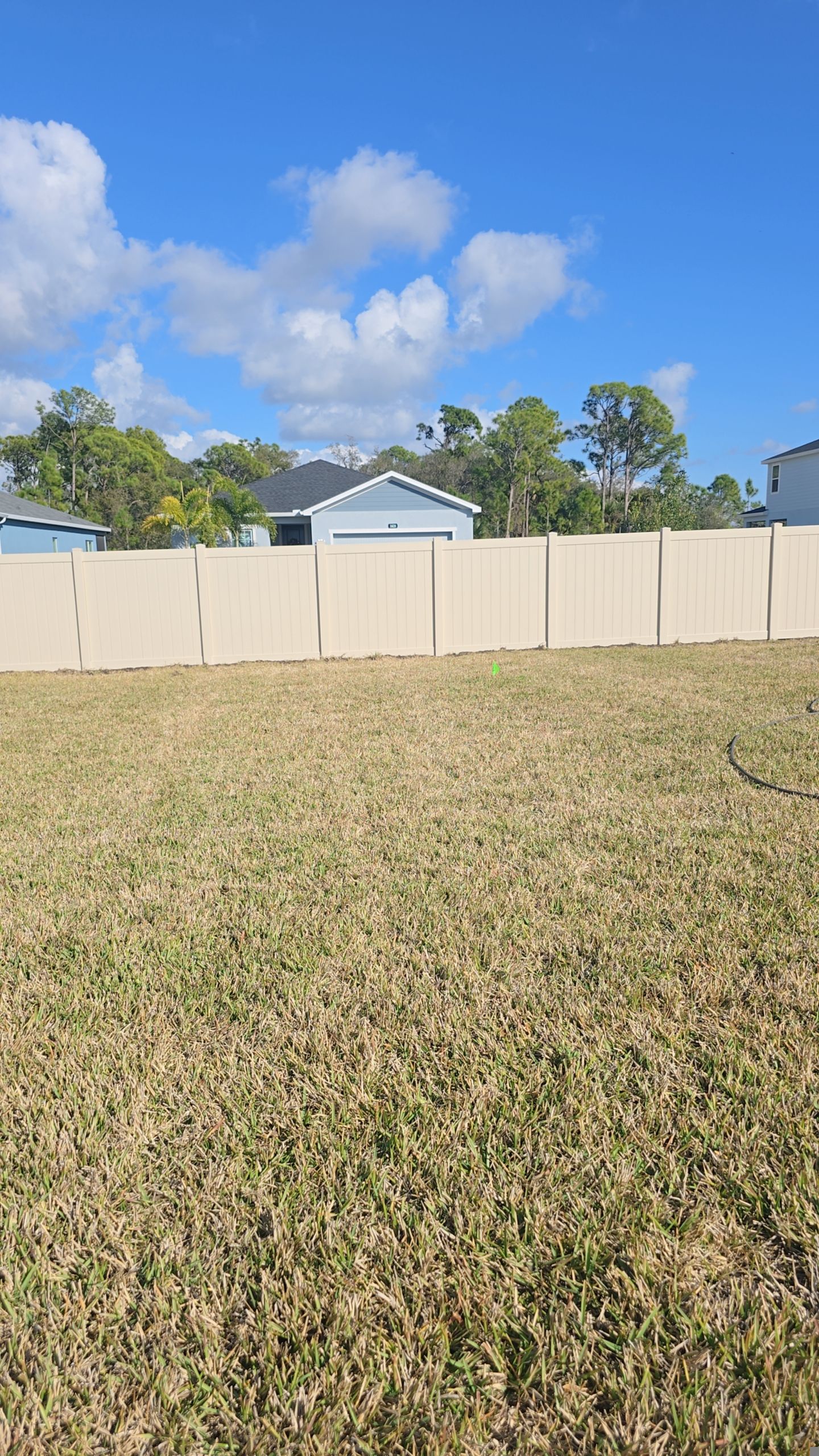 Tan Vinyl Fence in West Port by True Fence LLC