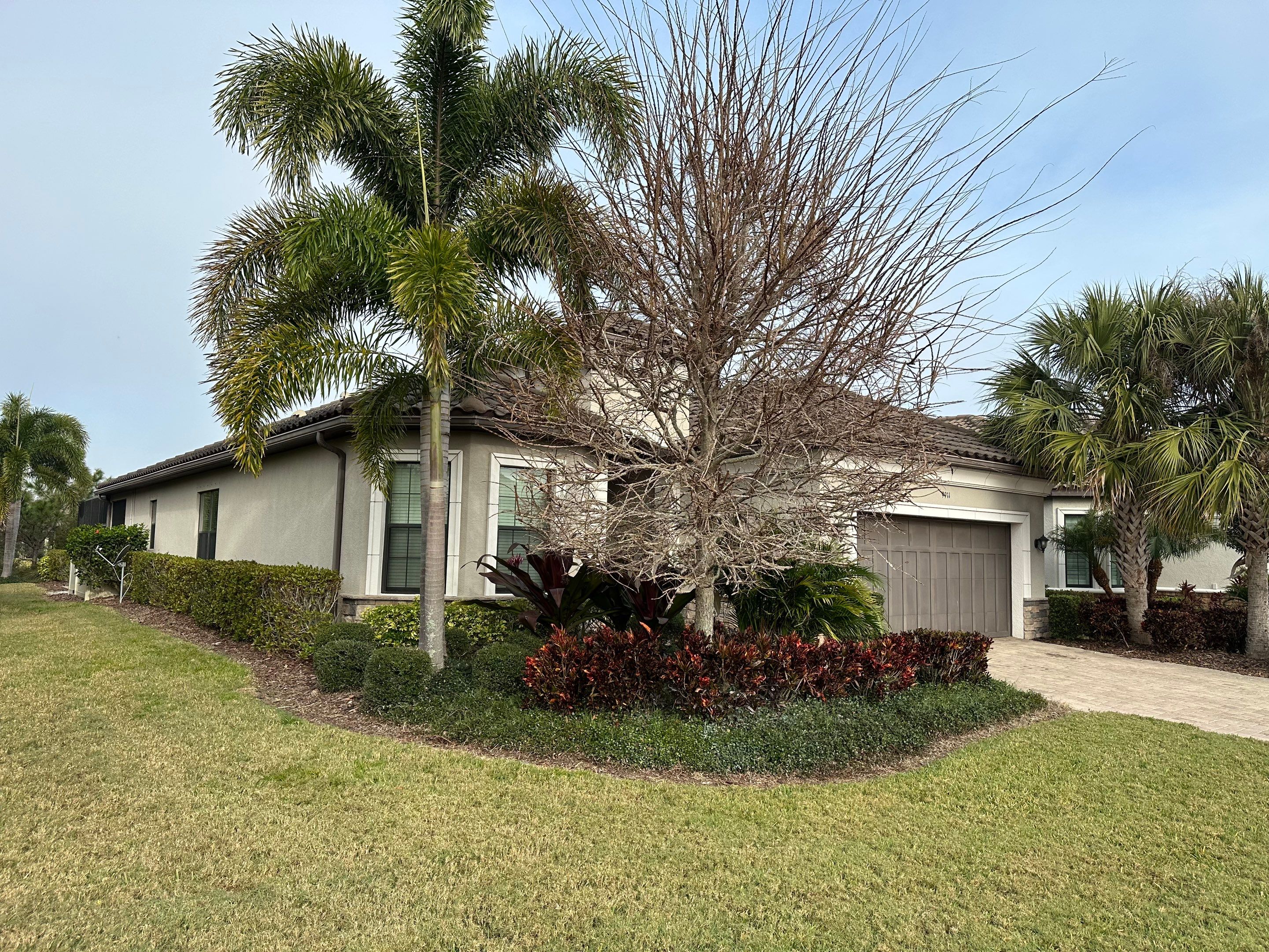 Concrete Tile Roof, Paver Pool Deck, Screen Enclosure & Driveway Cleaning in Artisan Lakes Esplanade, Palmetto, FL | Sunshine AquaWash by Sunshine AquaWash