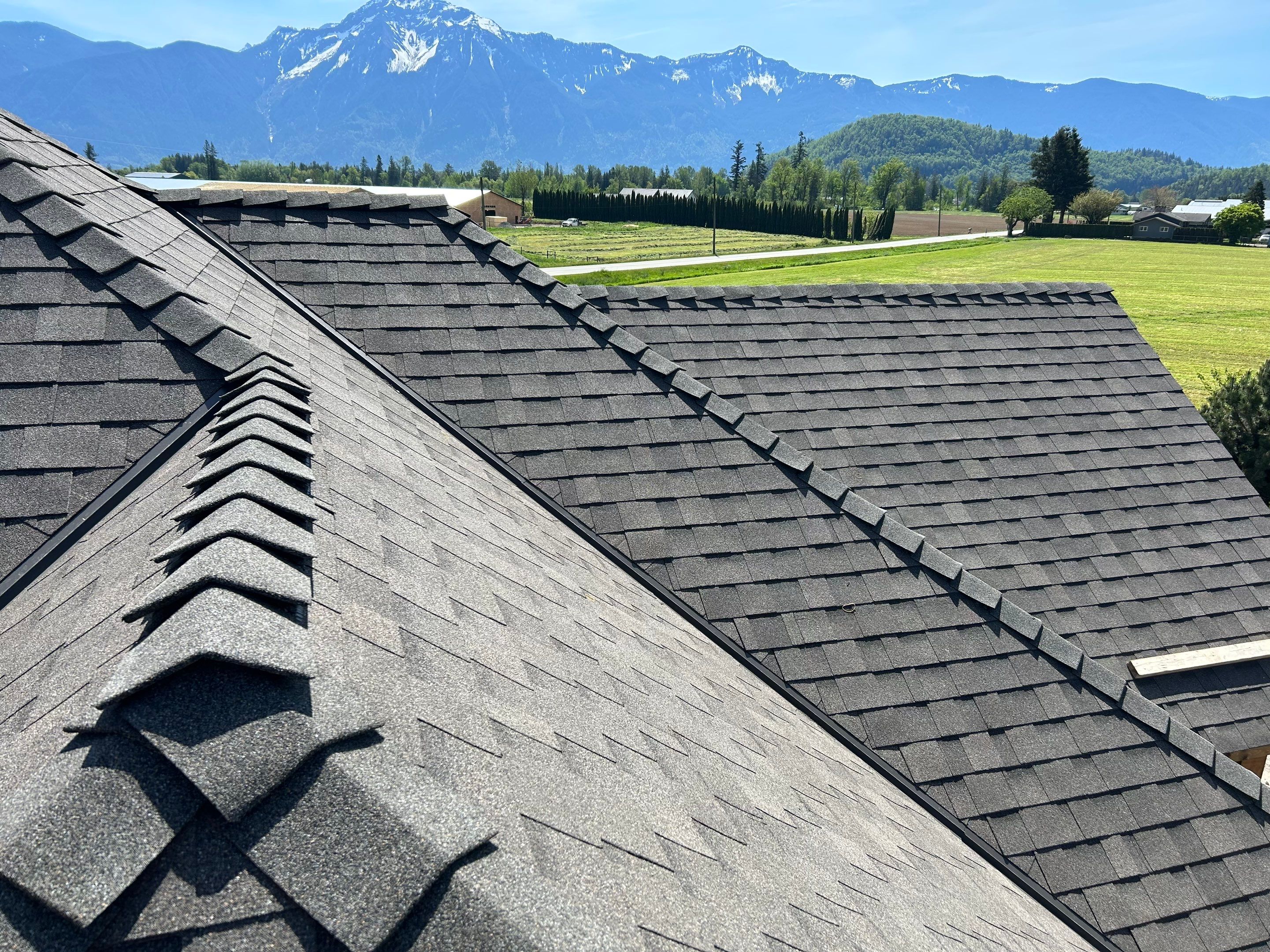 Residential Roofing Installation upgraded venting and hip and ridge capping by Top Notch Roofing Inc