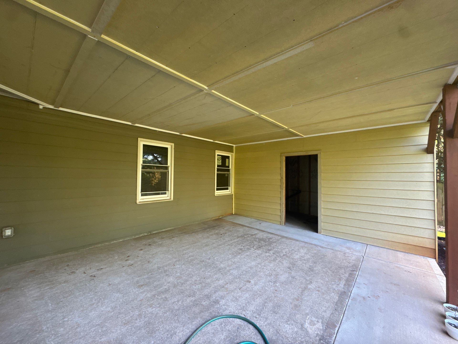 Exterior Modernization Featuring New Siding and Custom Wood Portico by Swift Home Renovations