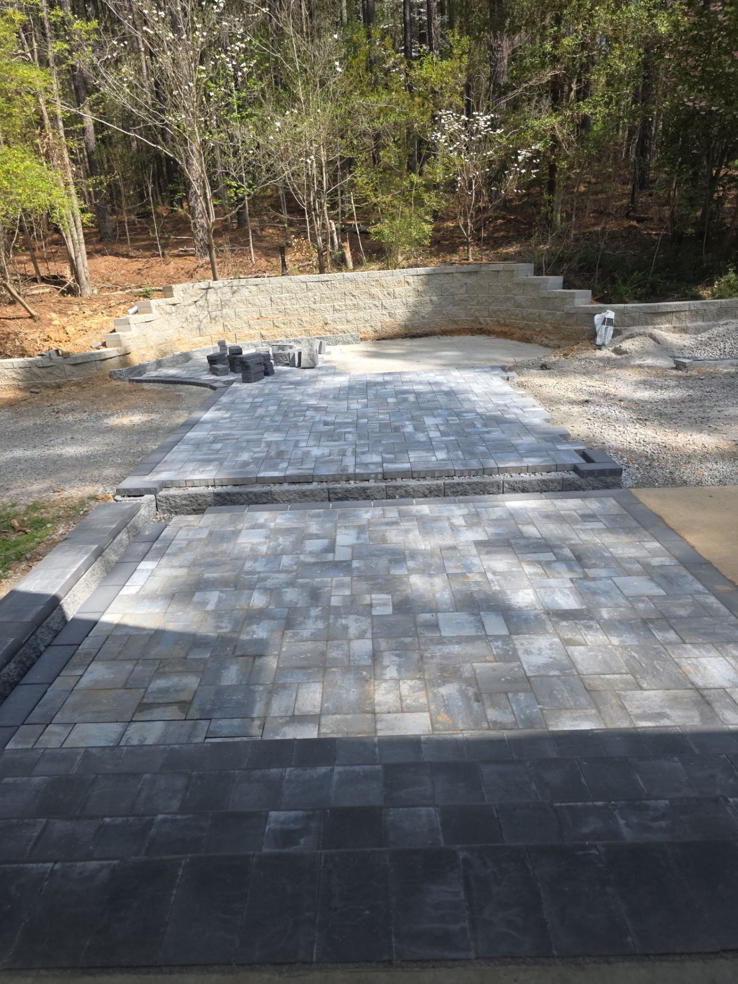 Pittsboro Outdoor Living Transformation – Retaining Wall, Paver Patio & Elevated Deck by Elite Remodeling and Design LLC