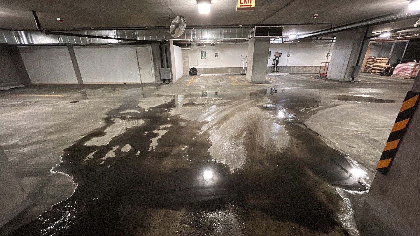 Parking garage using Hot water by Northern Power Washing LLC.