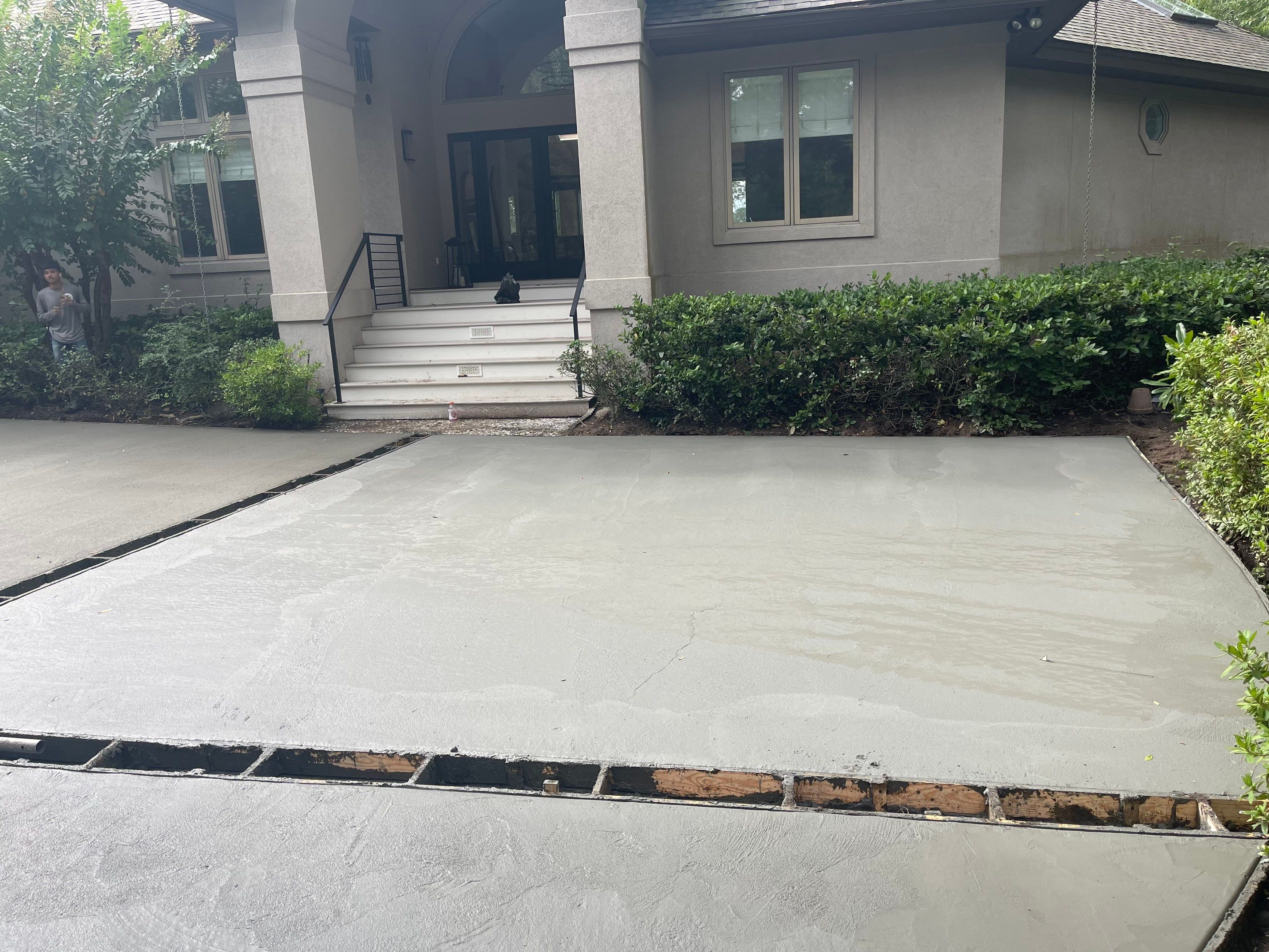 Custom Concrete Driveway with Decorative Paver Inlays in Hilton Head Island by Lowcountry Scapes, LLC
