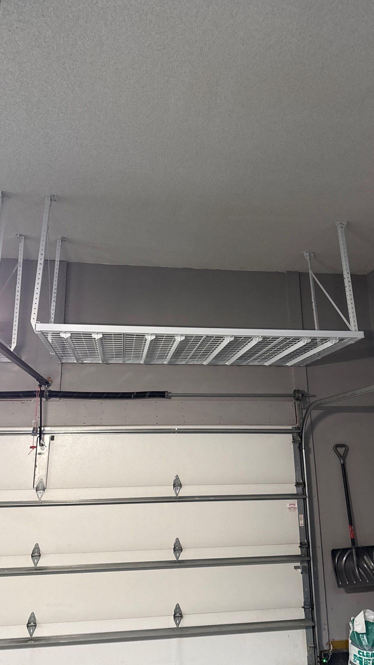 Ceiling Mounted Overhead Storage Rack Installation in Shawnee by Banner Garage