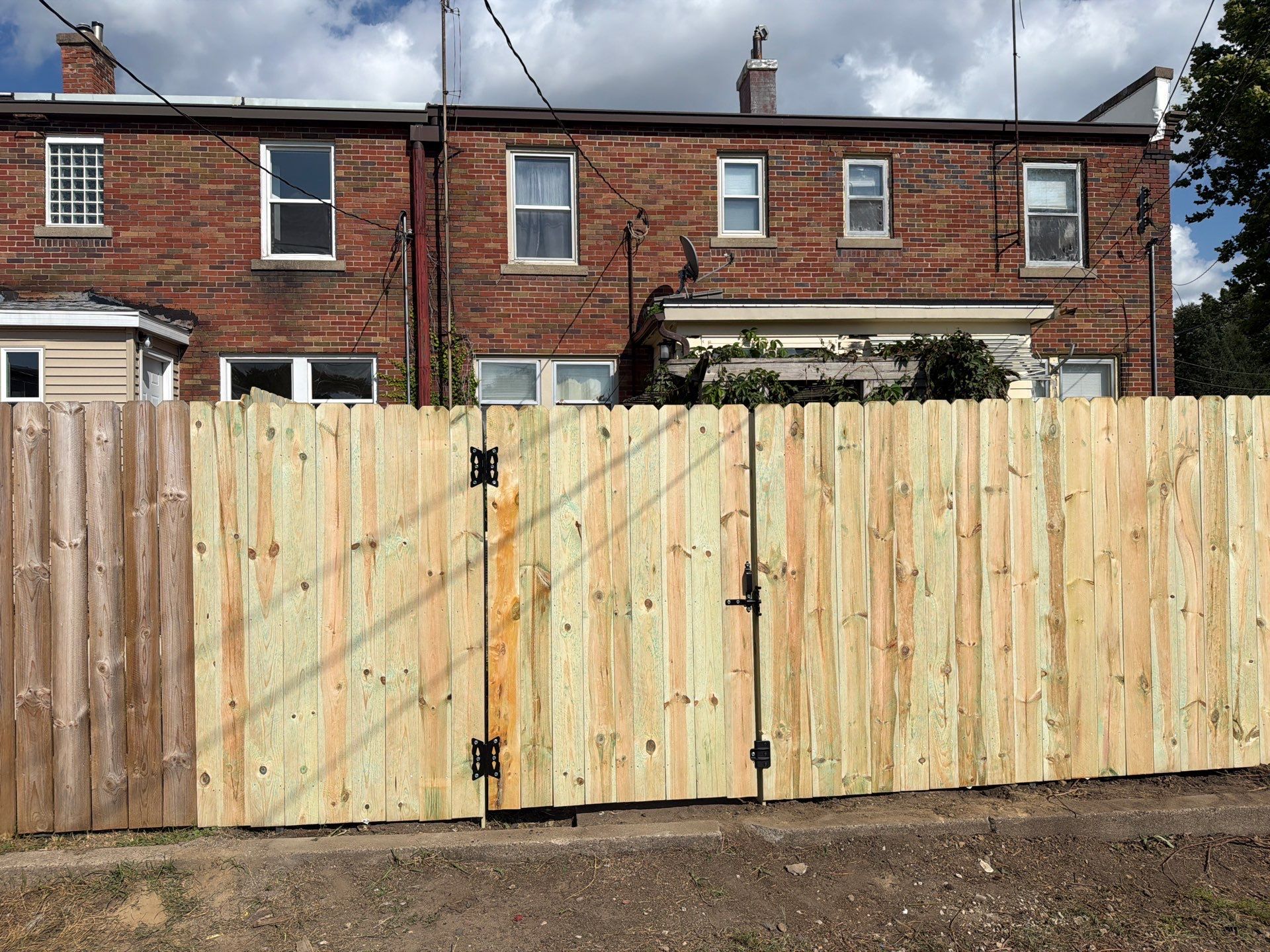 New Treated Wood Privacy Fence and Metal-Framed Gates by Perfect Picket Fence and Stain