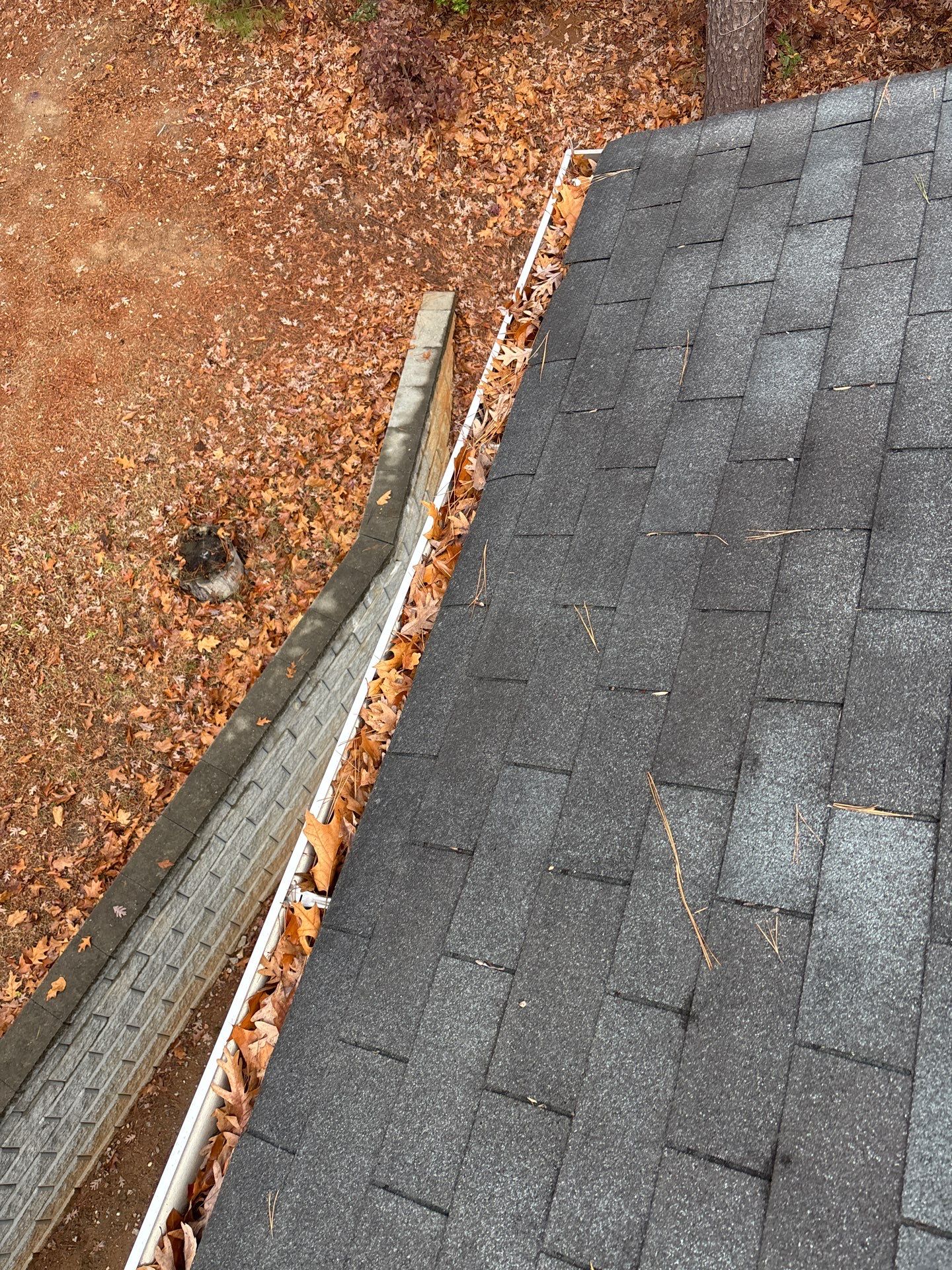 Commercial gutter cleaning Raleigh, NC before photo with filled gutters