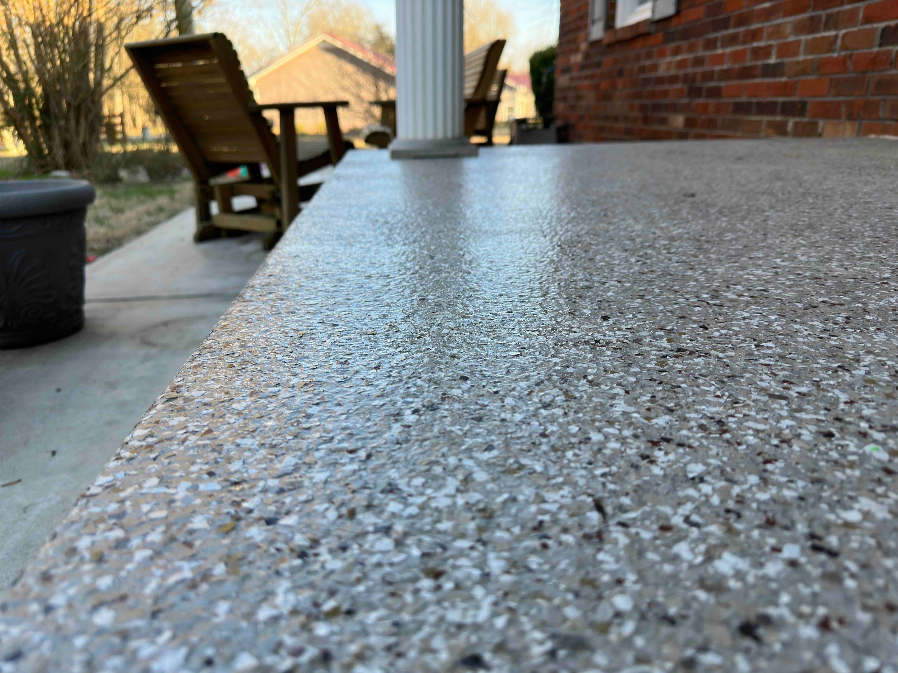 Front Porch and Garage using Creekbed by Elite Floor Solutions