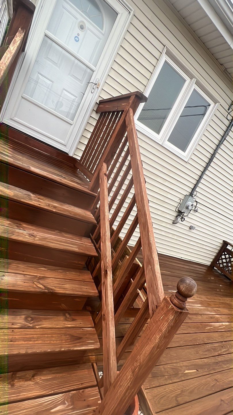 Wood cleaning and staining using Armstrong cloark oil stain by Northern Power Washing LLC.