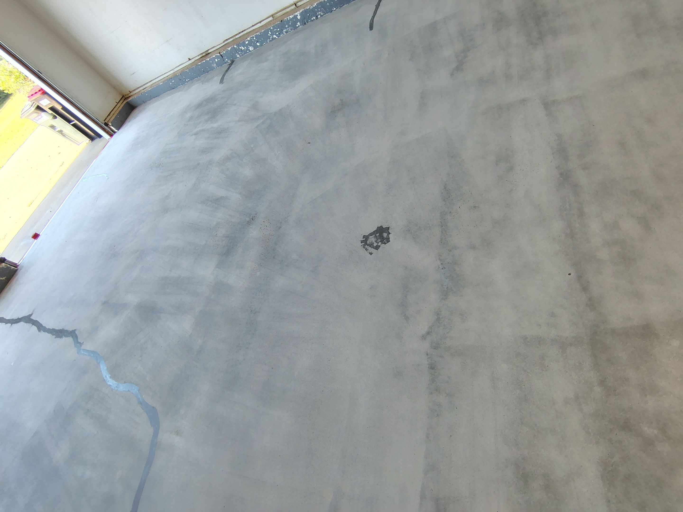 Feather Grey Garage Floor Coating Installation in Valley Springs by Select Painting, Coatings & Garage Cabinets